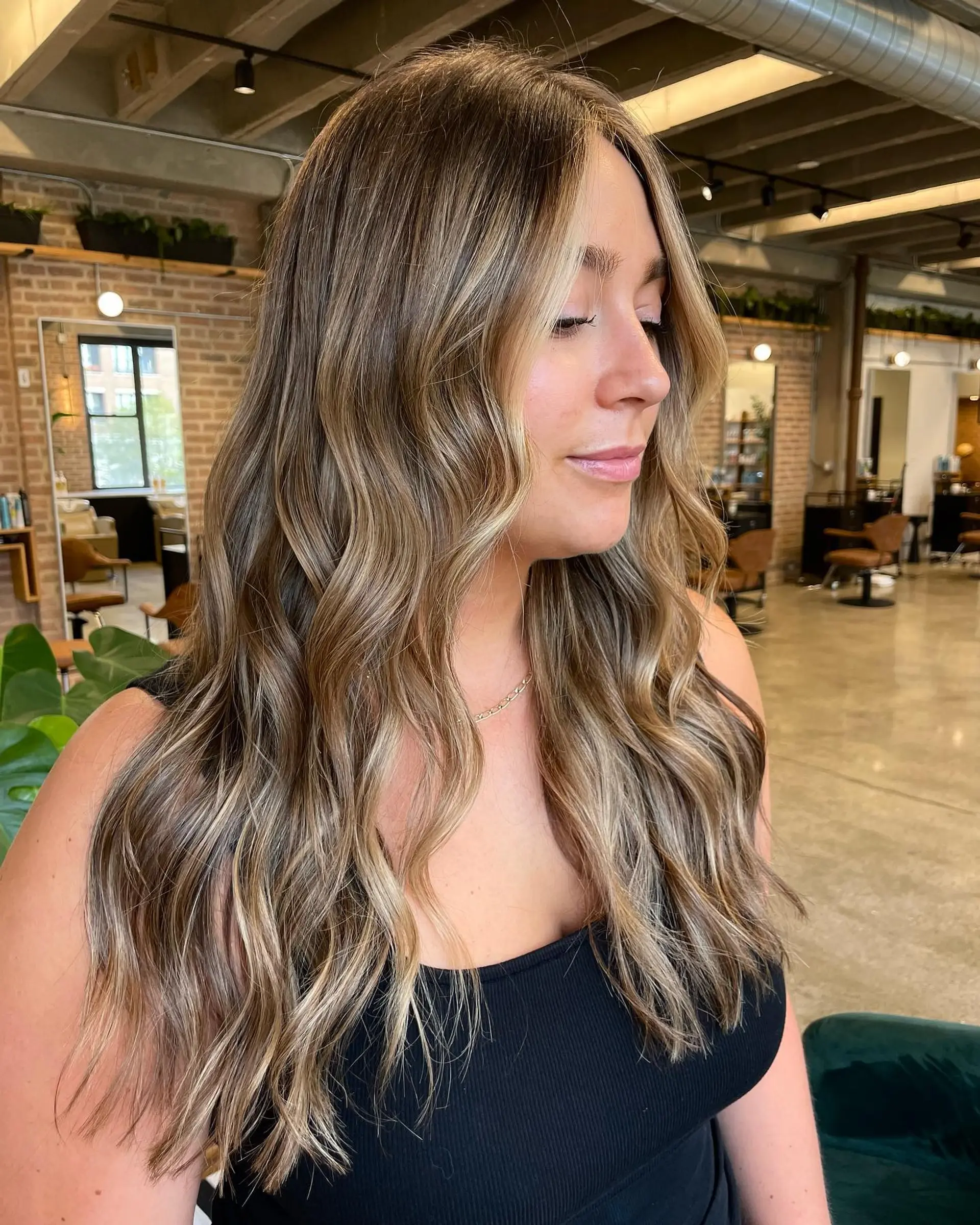 Long, wavy hair with a caramel balayage. 2