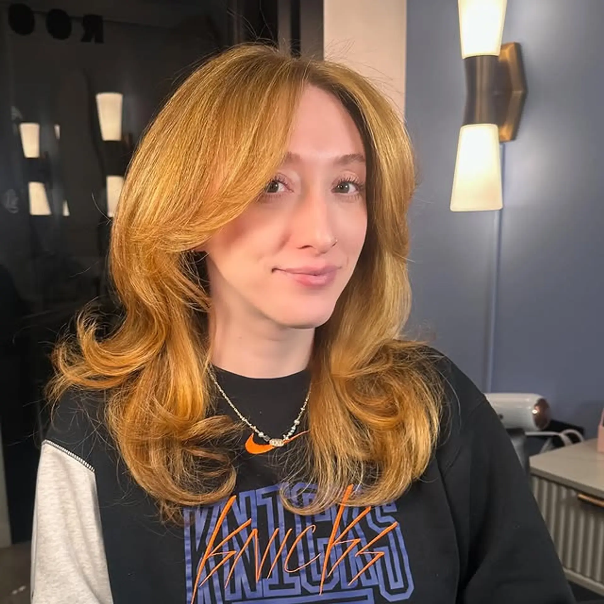 This hairstyle features layers and face framing bangs. 1