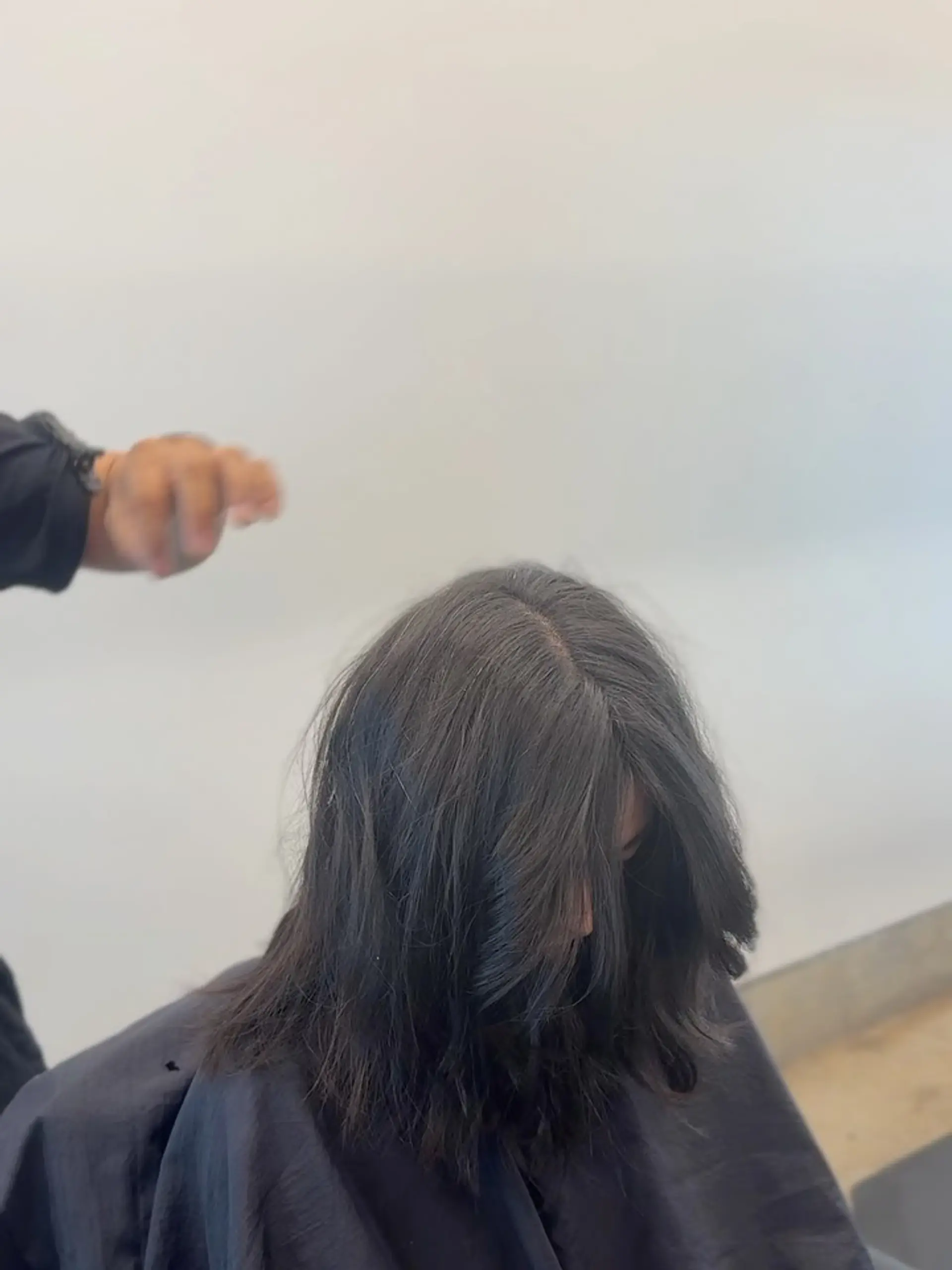 Medium-length dark hair featuring soft face-framing layers and a center part. 1