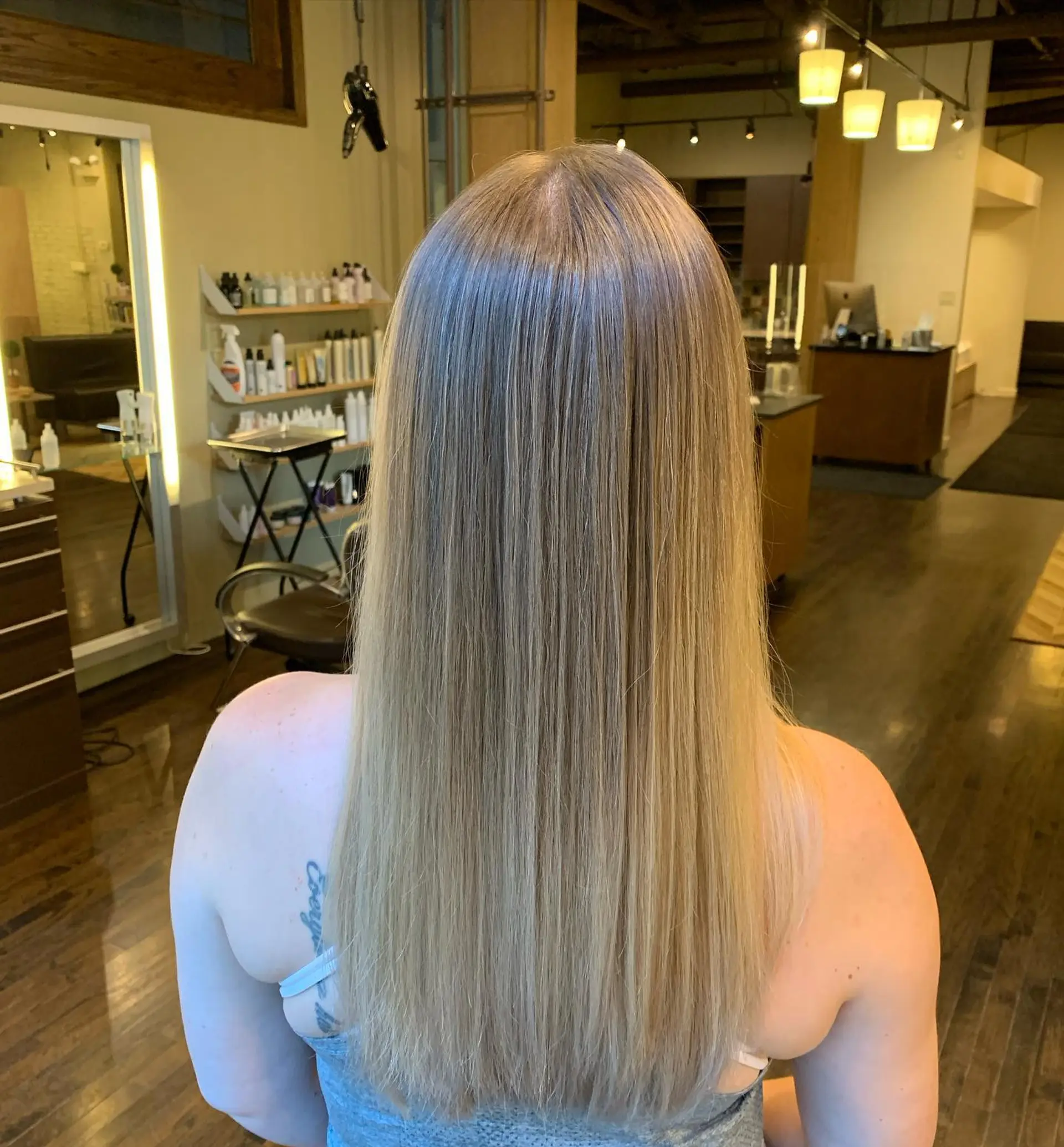 Long, straight hair with a seamless blonde balayage. 1