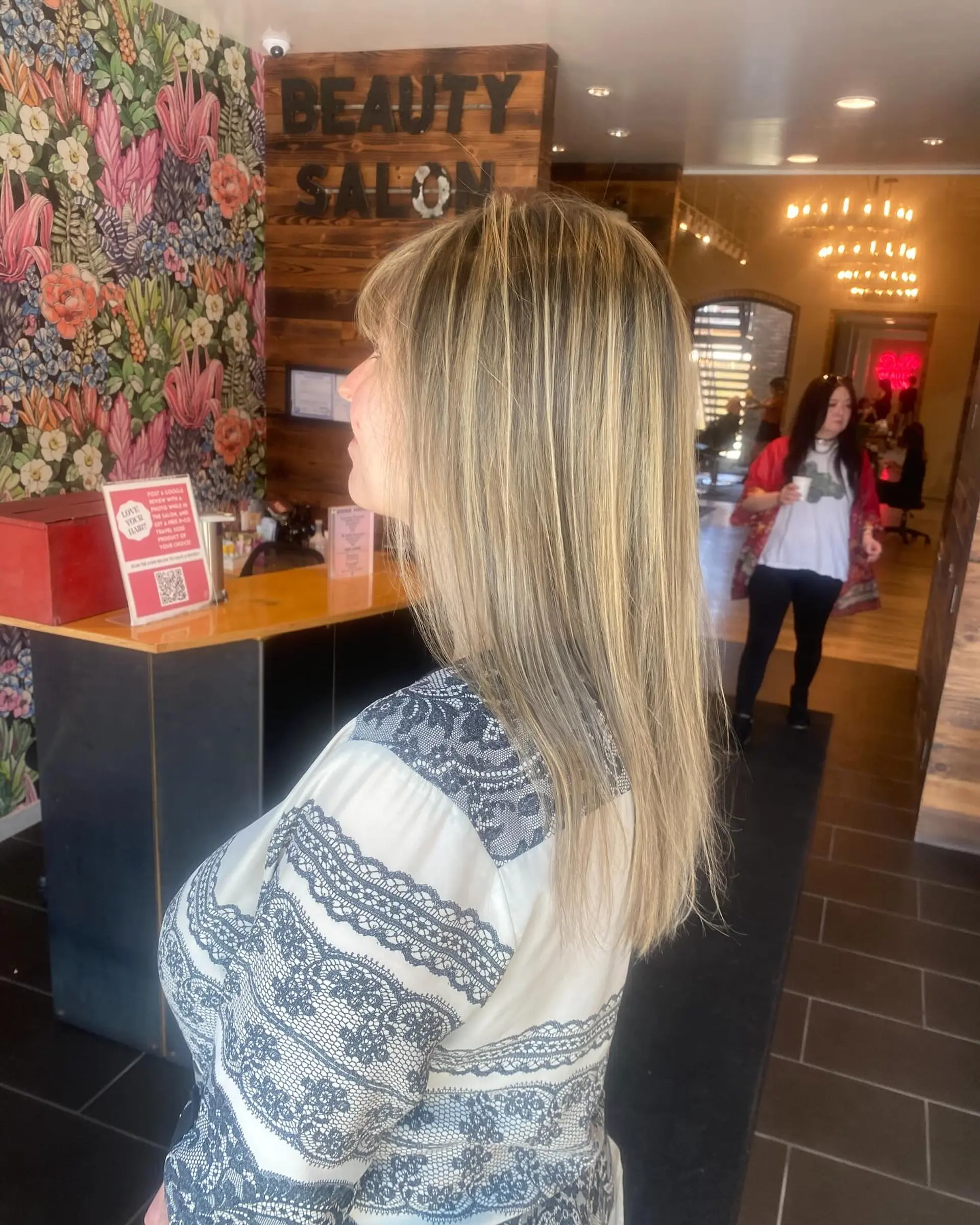 Long, straight hair with blonde balayage and natural brown roots. 2