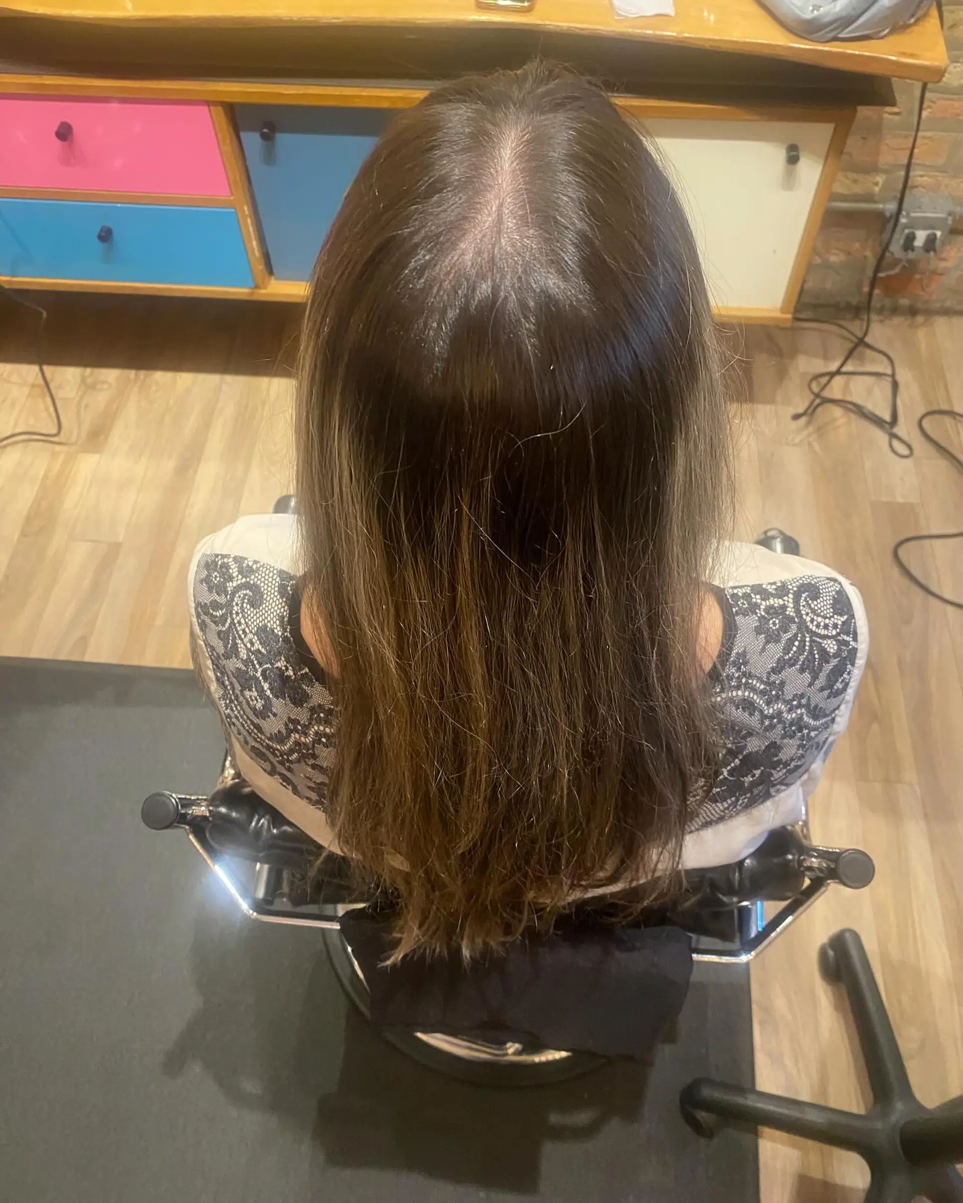 Long, straight hair with blonde balayage and natural brown roots. 3