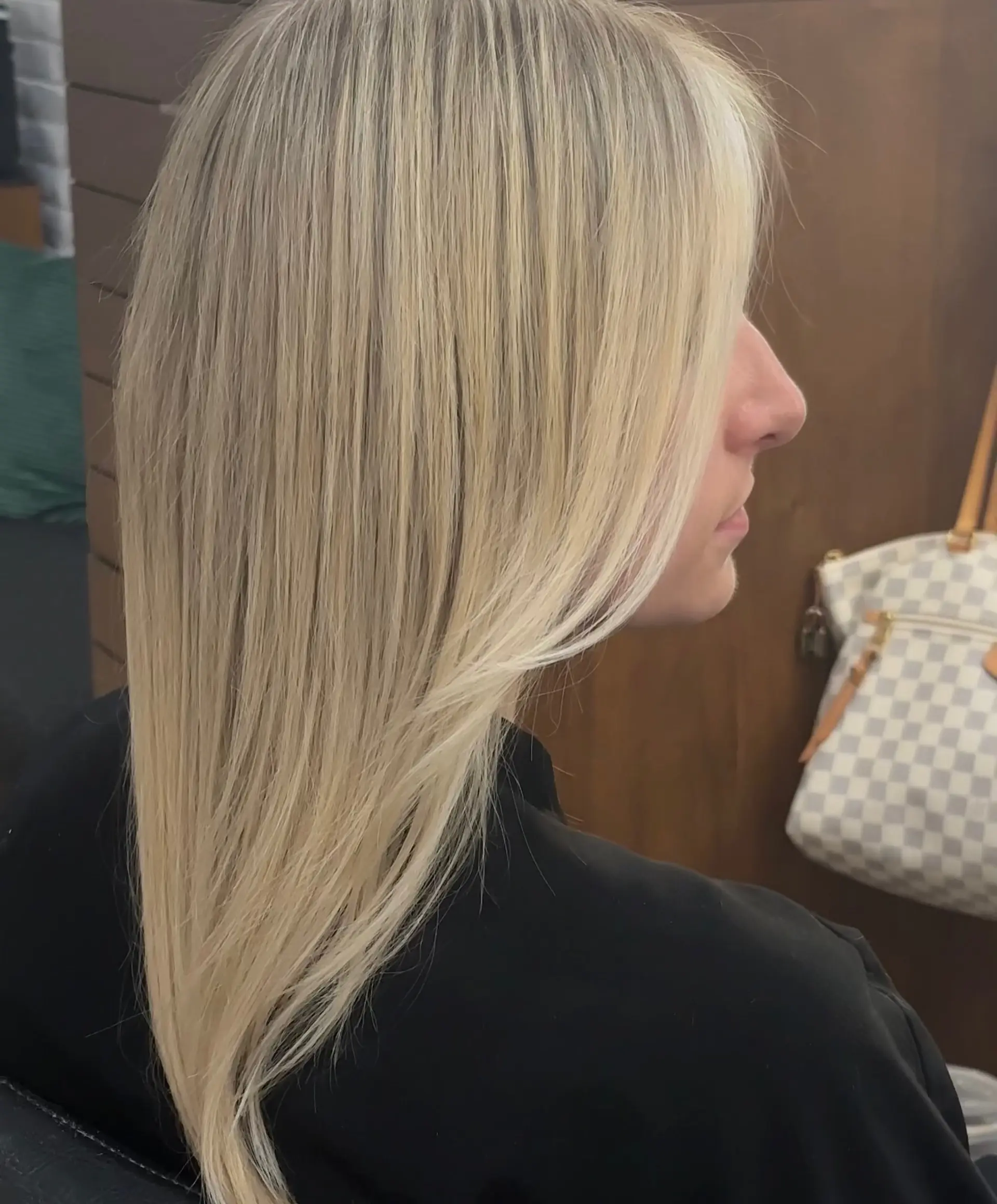Sleek, straight bright blonde hair with seamless highlights and soft face-framing layers. 1
