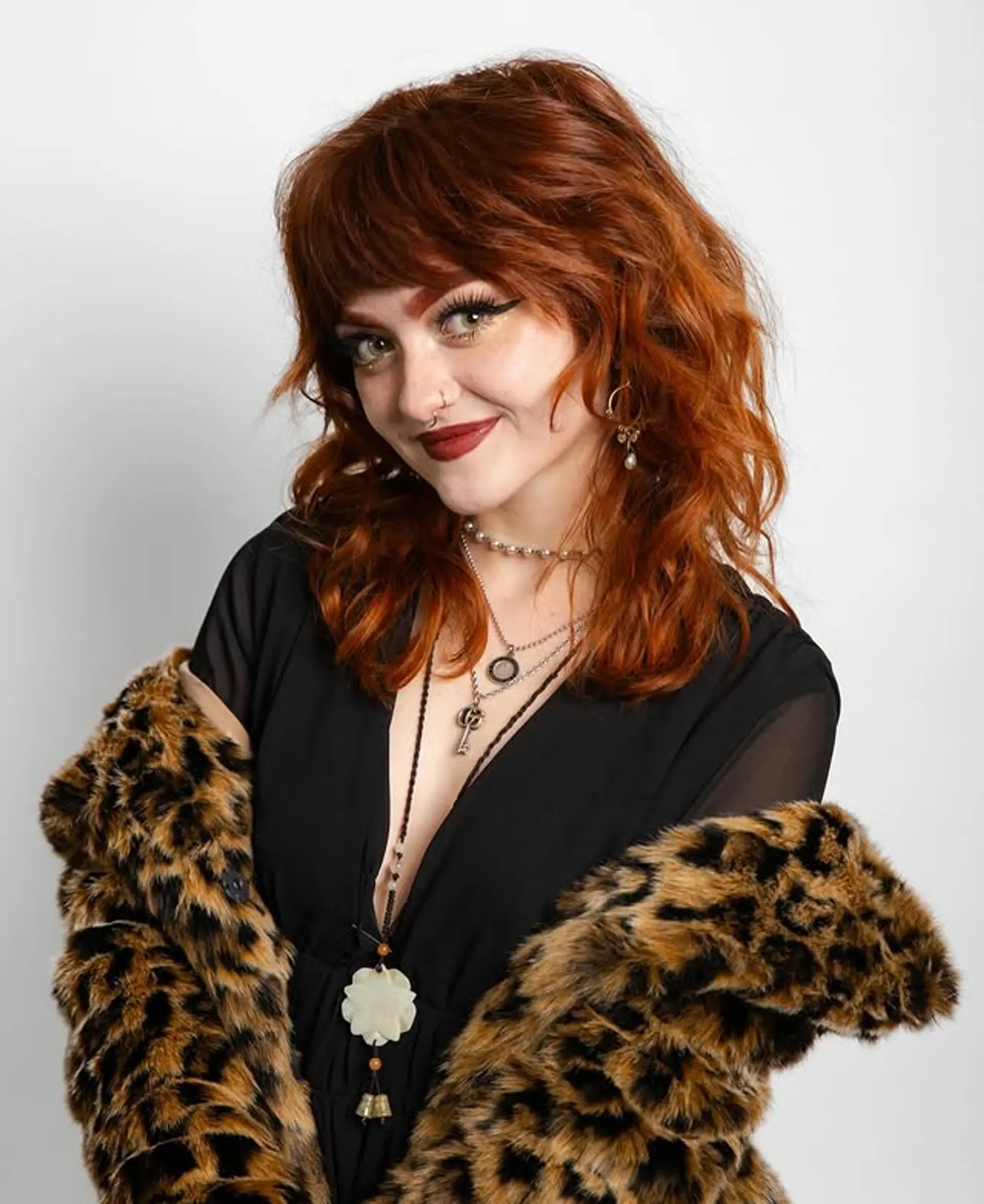 A medium-length shag with textured layers and wispy fringe bangs. 1