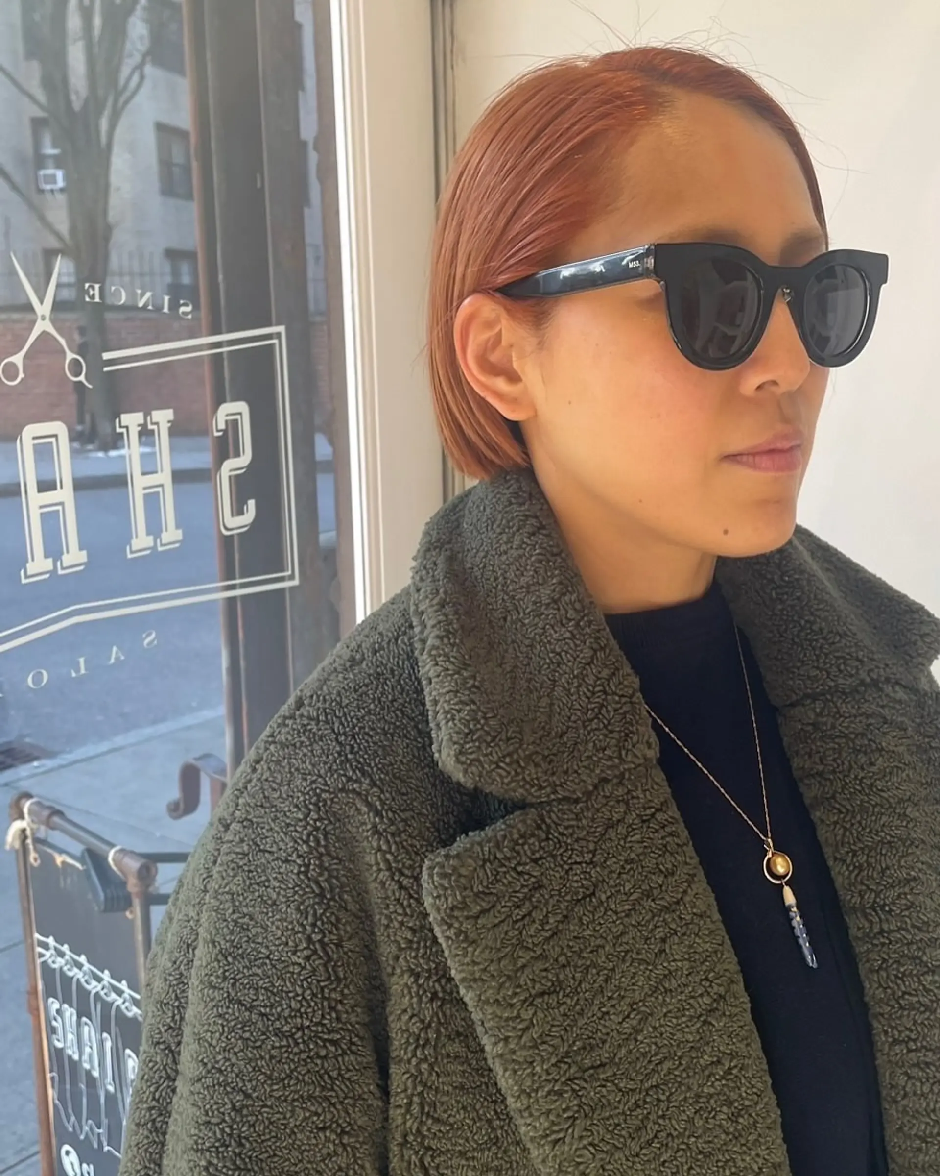 A sleek, blunt bob cut in a vibrant copper tone. 2