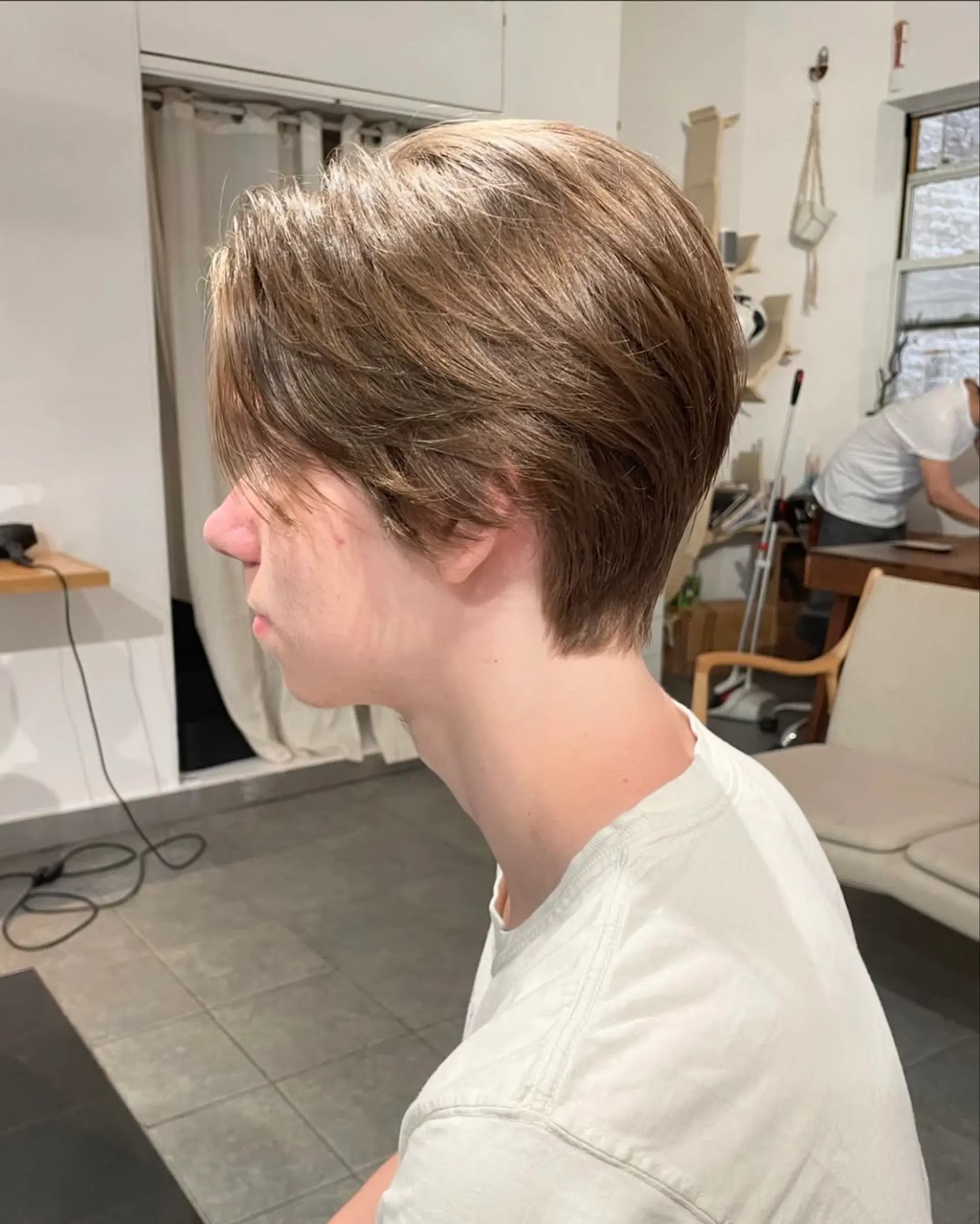 A layered, medium-length haircut with a center part and textured ends. 2