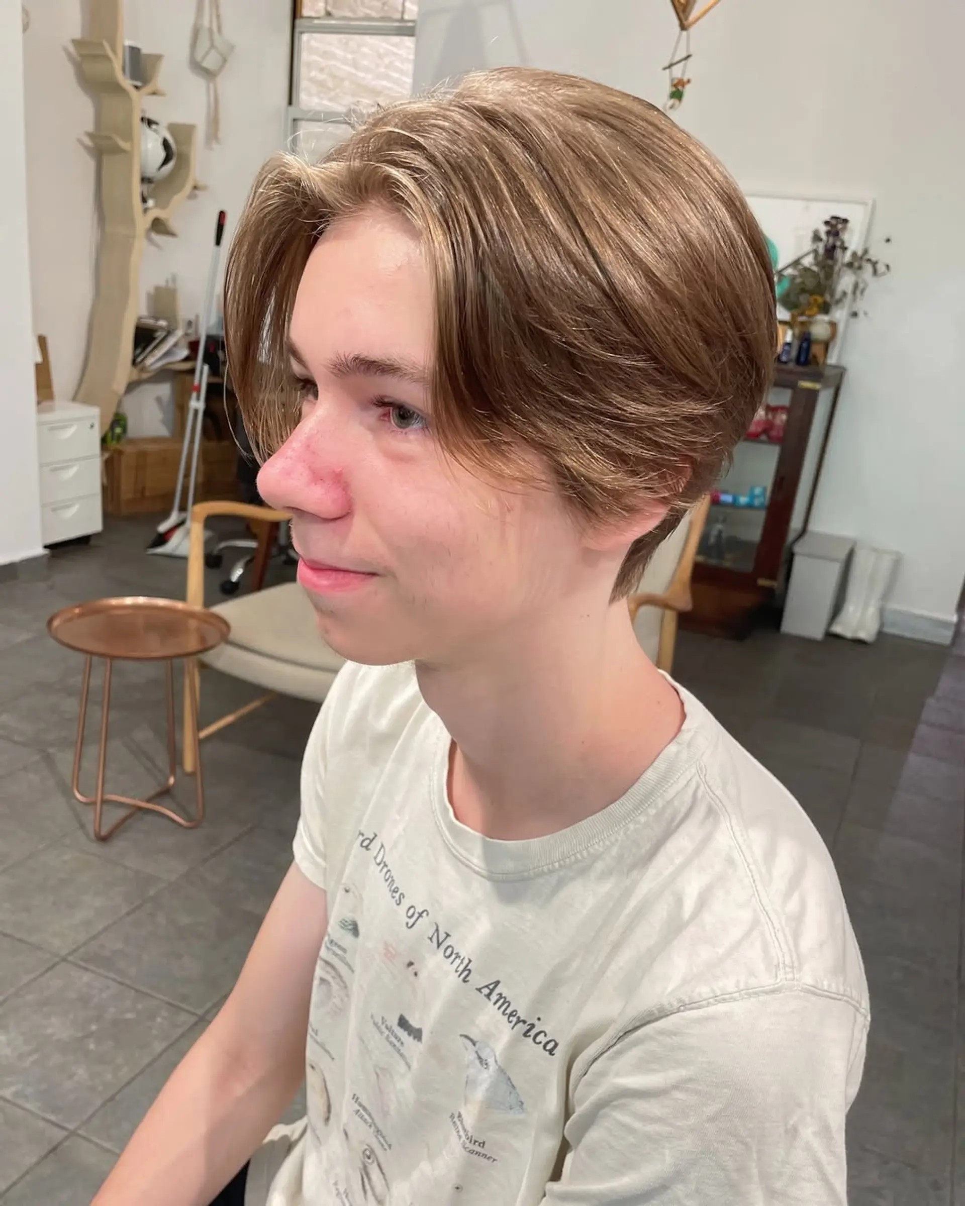 A layered, medium-length haircut with a center part and textured ends. 3