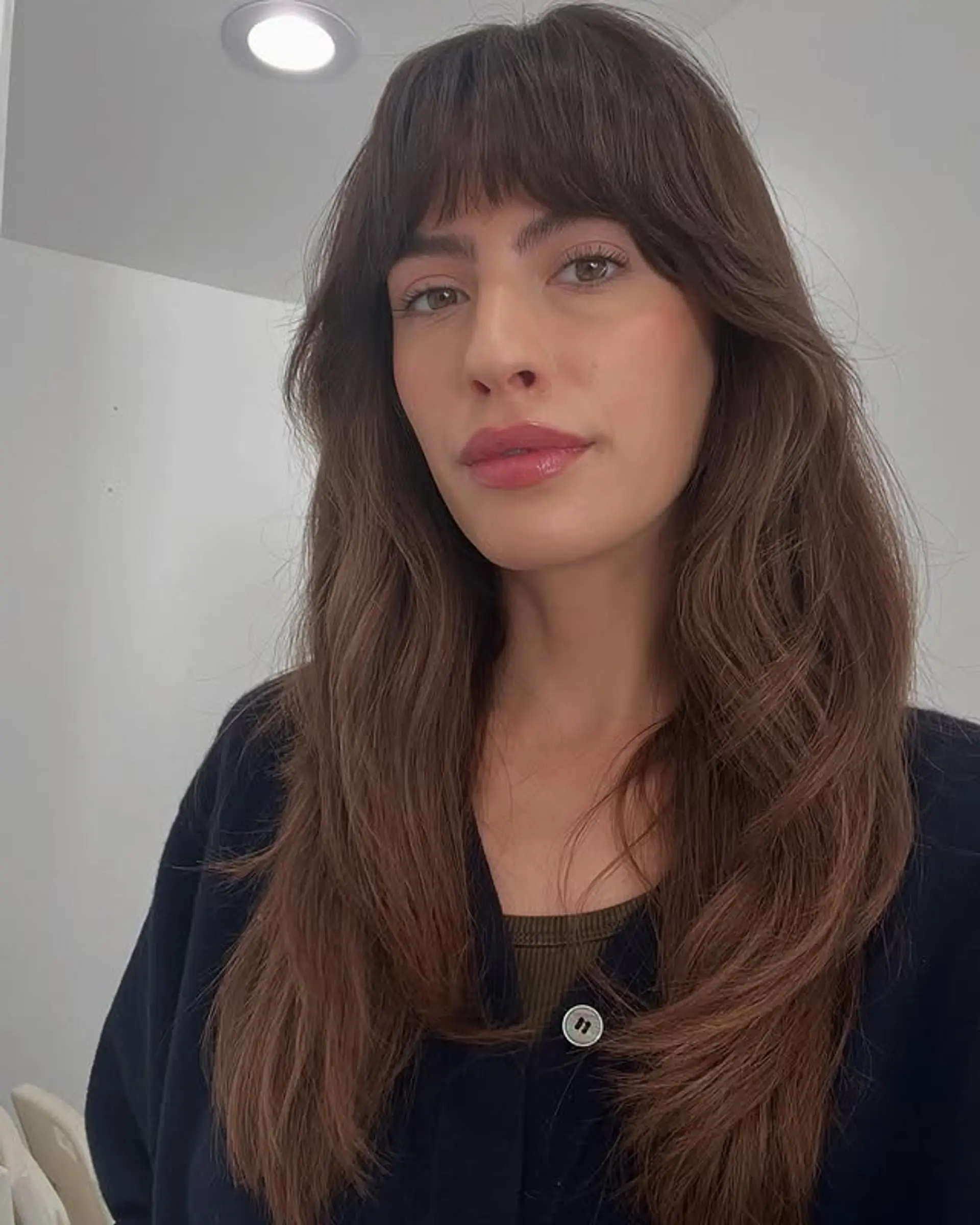 A long, wavy shag with curtain bangs and face-framing layers. 1