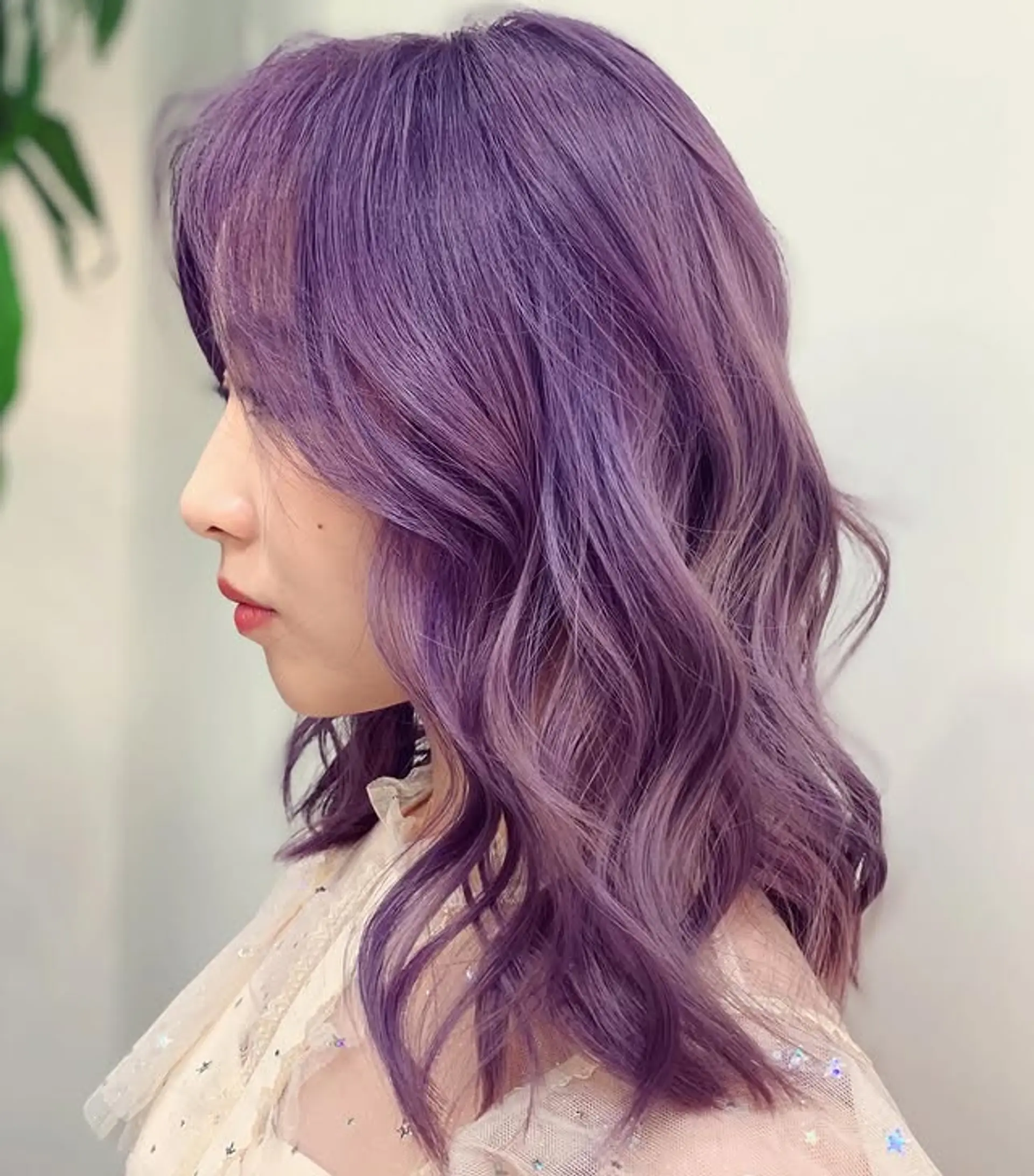 Medium length wavy hairstyle with a pastel lilac lavender color. 1