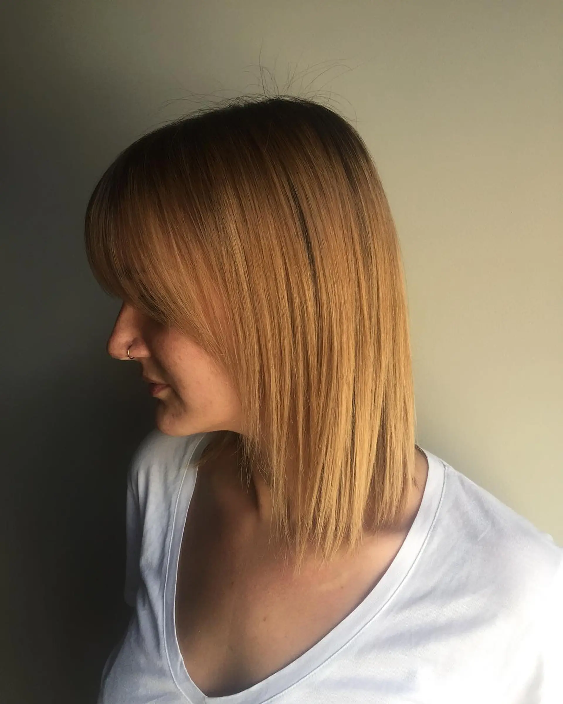 A trendy, straight blunt bob with bangs. 1