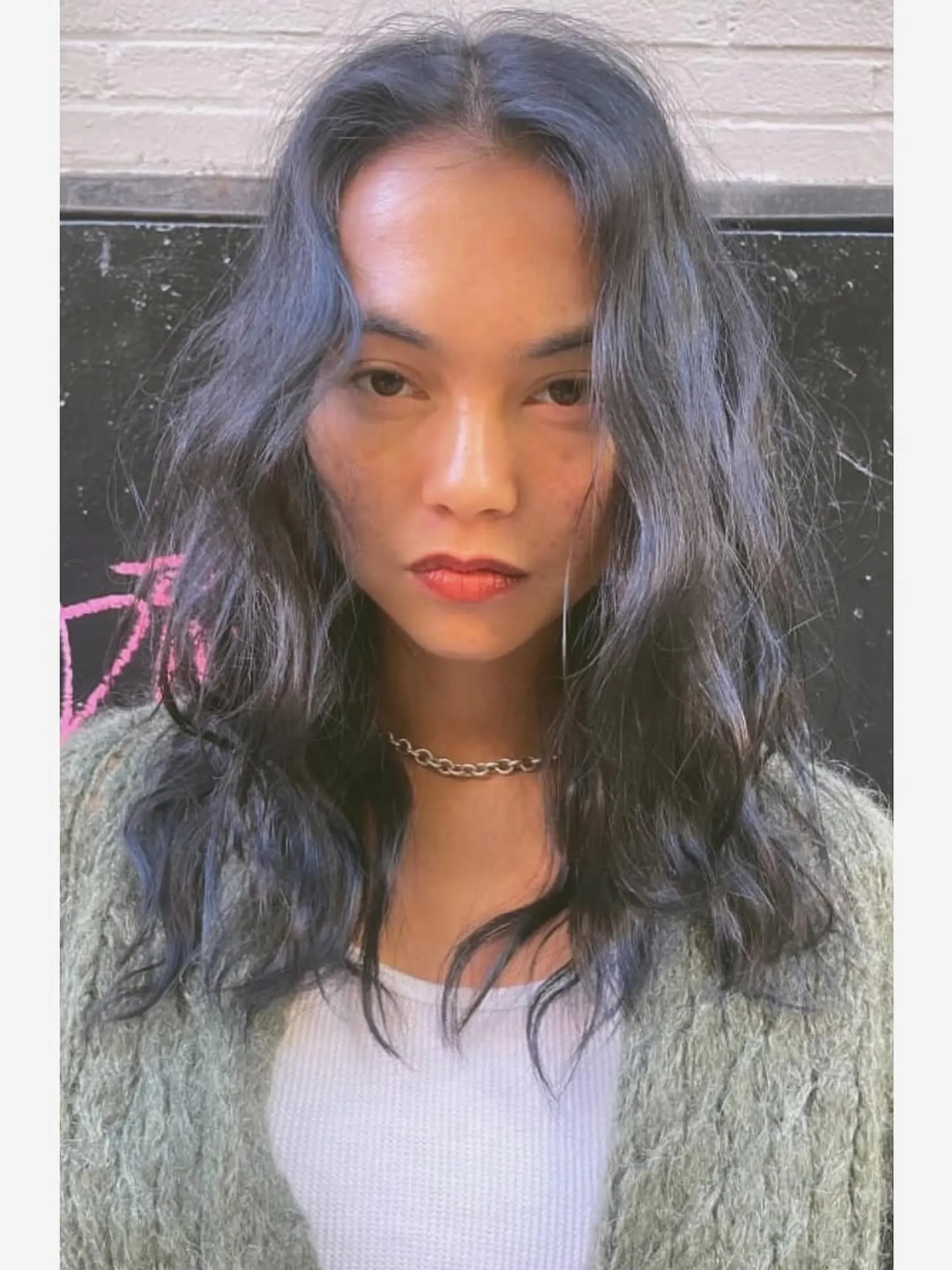 A medium-length, wavy shag cut with textured, face-framing layers and a soft, tousled finish. 1