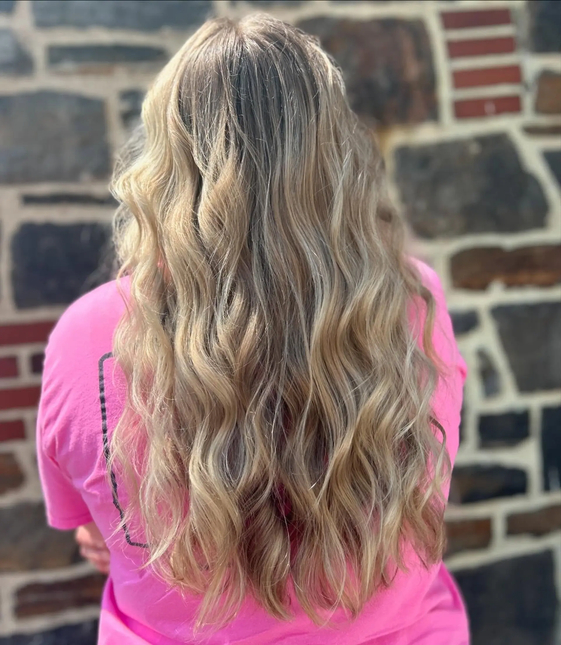 Long, flowing dimensional blonde hair with soft, loose waves cascading down the back. 1