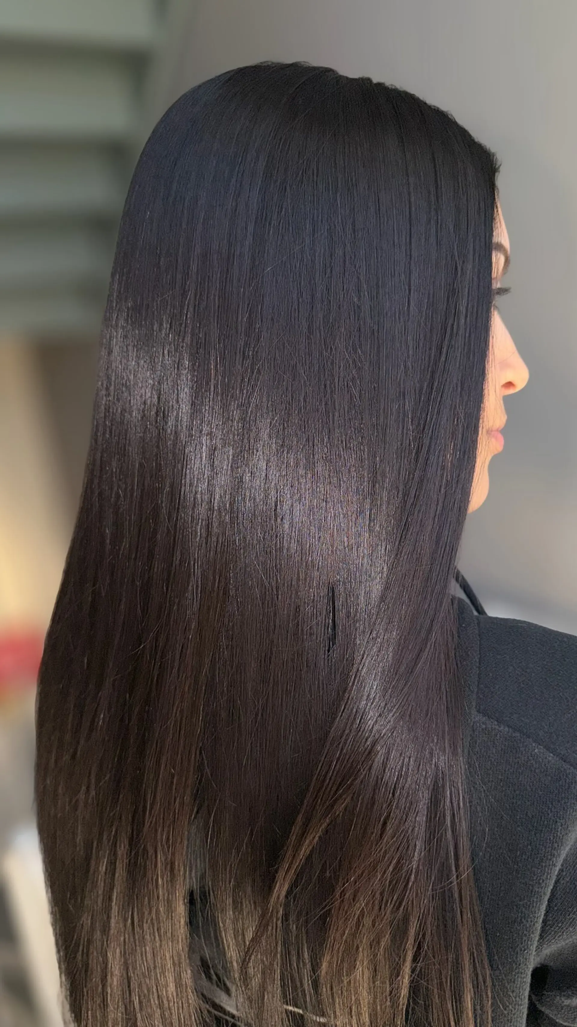 Long, ultra-sleek dark hair with a healthy, high-shine finish. 1