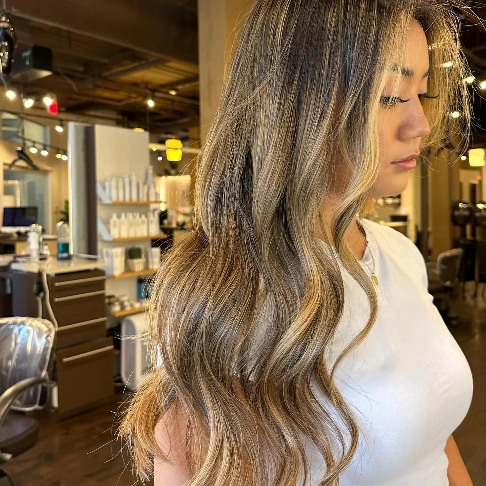 Long, wavy hair with a honey blonde balayage. 1