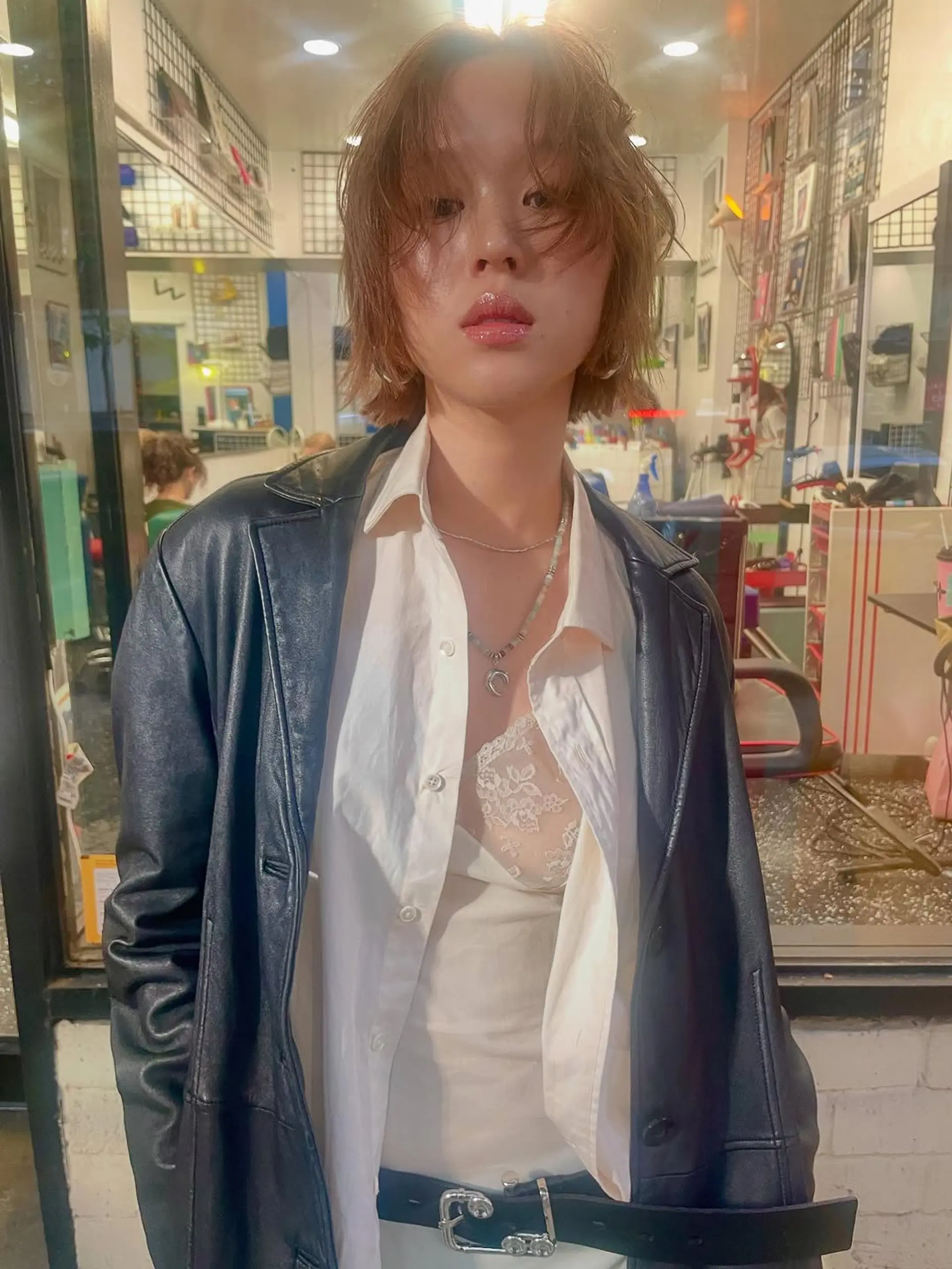 A layered, textured bob with a shaggy finish, featuring soft, face-framing curtain bangs and a messy, piecey aesthetic. 1
