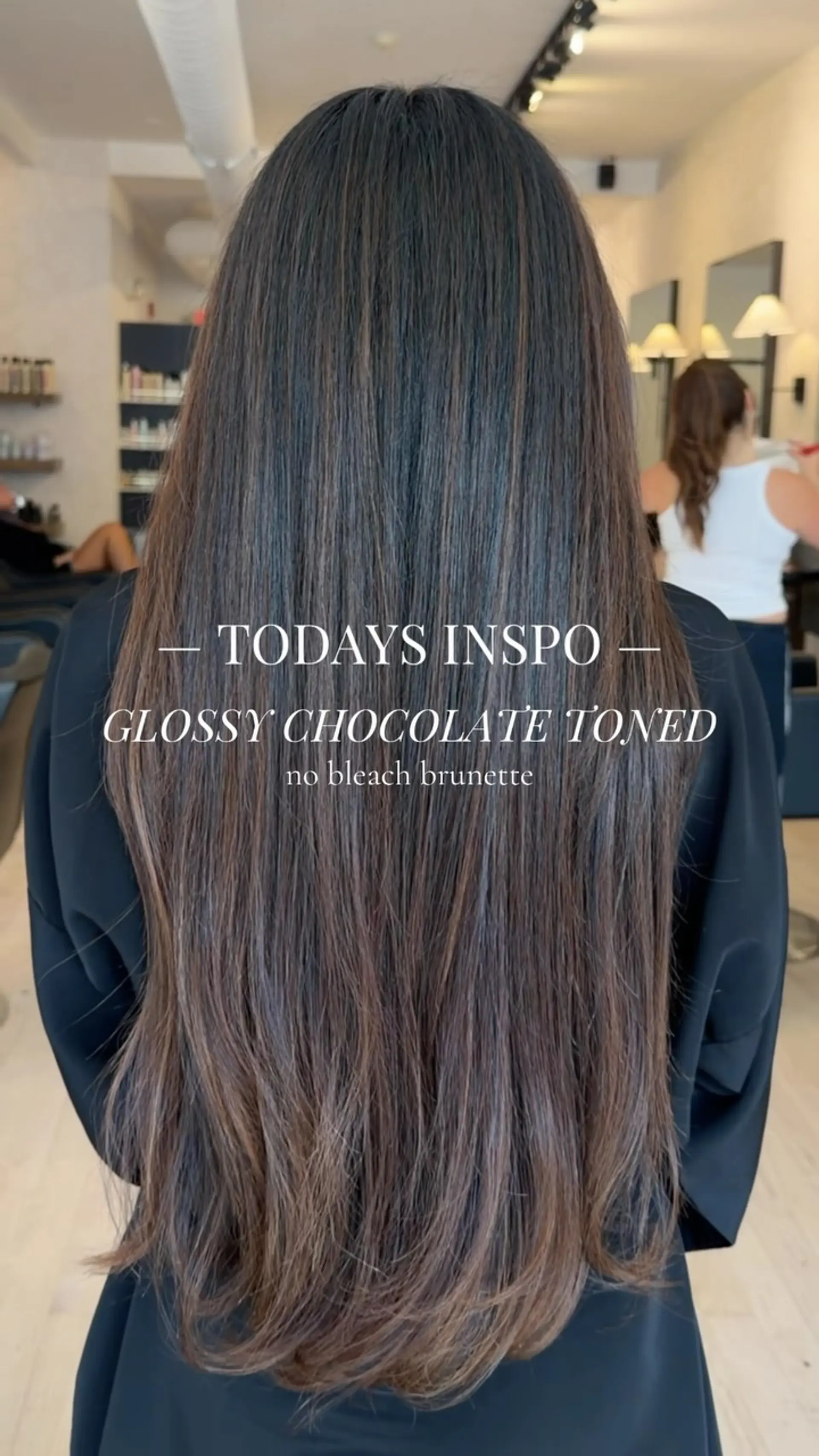 Extra-long glossy chocolate brown hair featuring subtle soft dimension and a smooth, polished blowout. 1