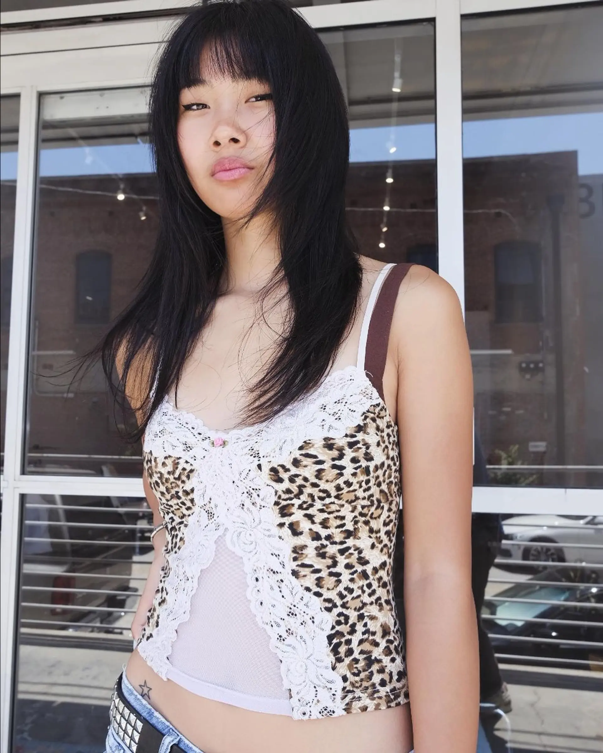 Medium-length, black straight hair with blunt bangs and face-framing layers, featuring a smooth, layered cut. 1