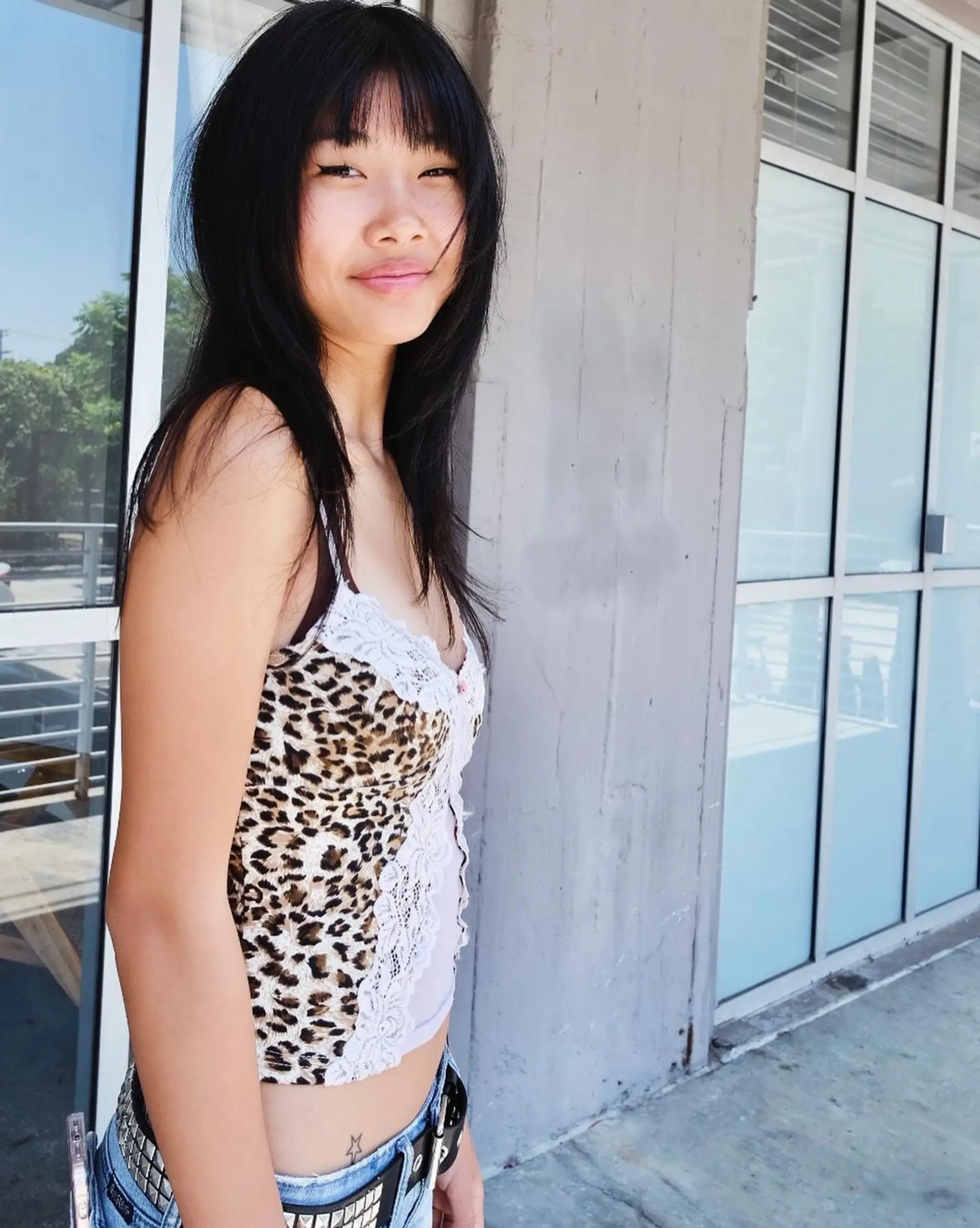 Medium-length, black straight hair with blunt bangs and face-framing layers, featuring a smooth, layered cut. 2