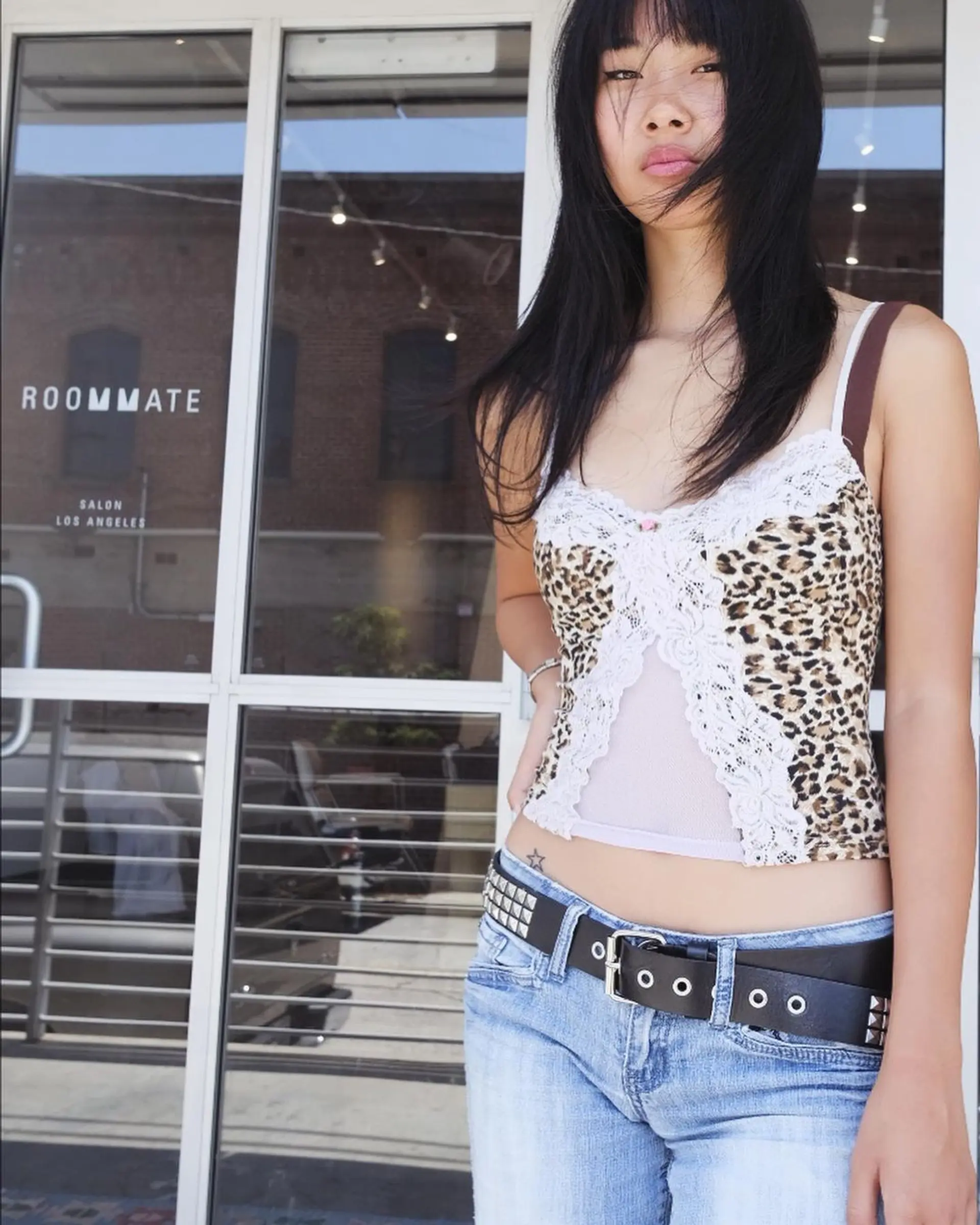 Medium-length, black straight hair with blunt bangs and face-framing layers, featuring a smooth, layered cut. 3