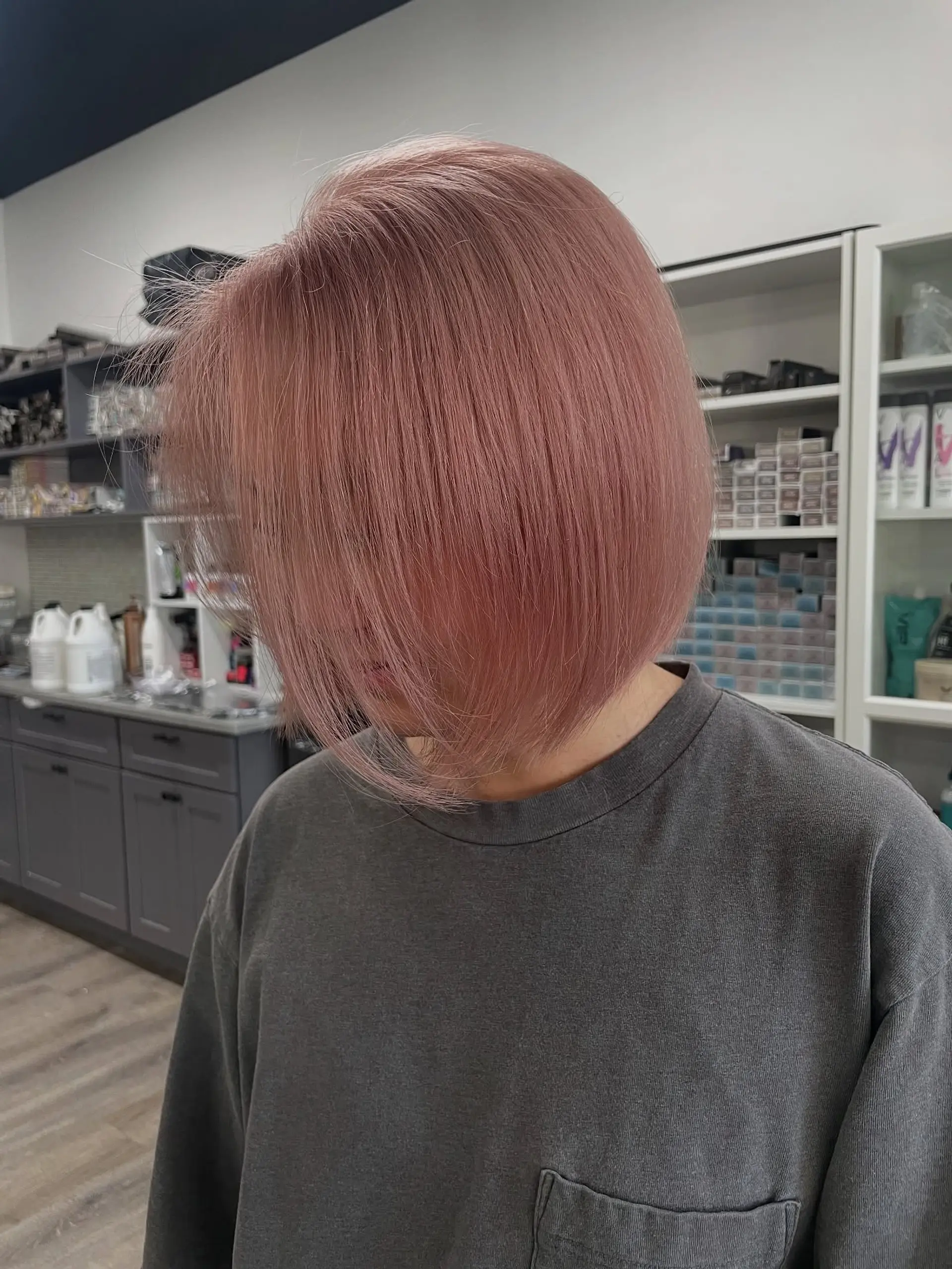 A modern blunt bob with a clean, straight edge. The length is short and chic, providing a polished look. 1