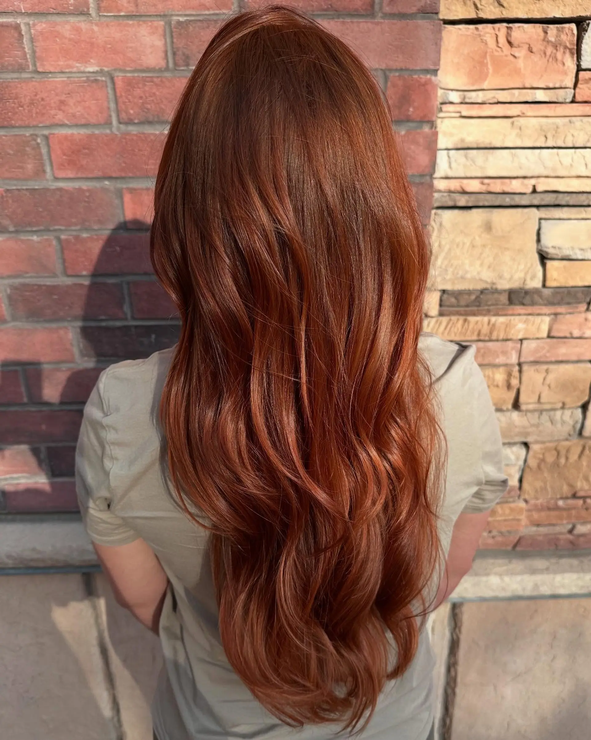 Long, vibrant auburn copper hair styled with soft cascading waves. 1
