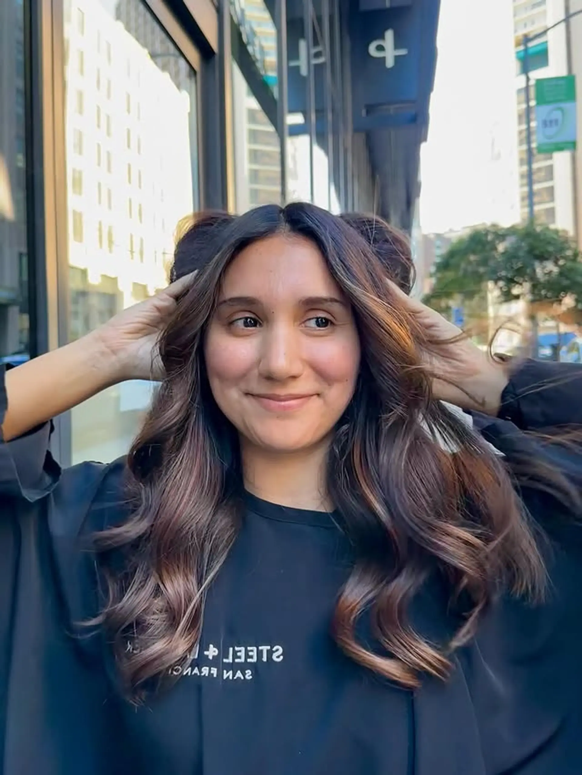 A bronzed balayage on medium wavy hair with dark roots. 1