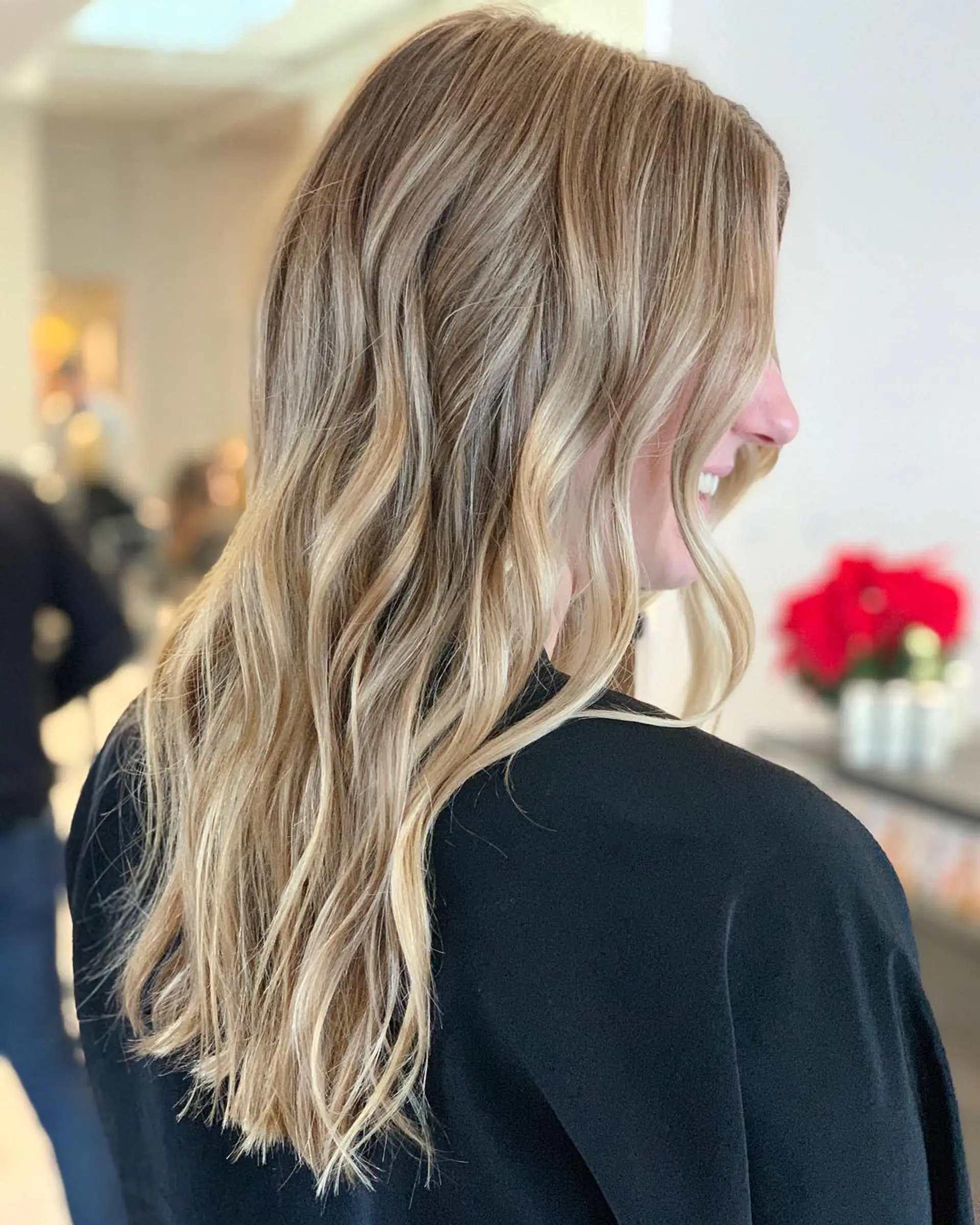Long hair featuring fine, sun-kissed babylights seamlessly blended into soft, lived-in waves. 1