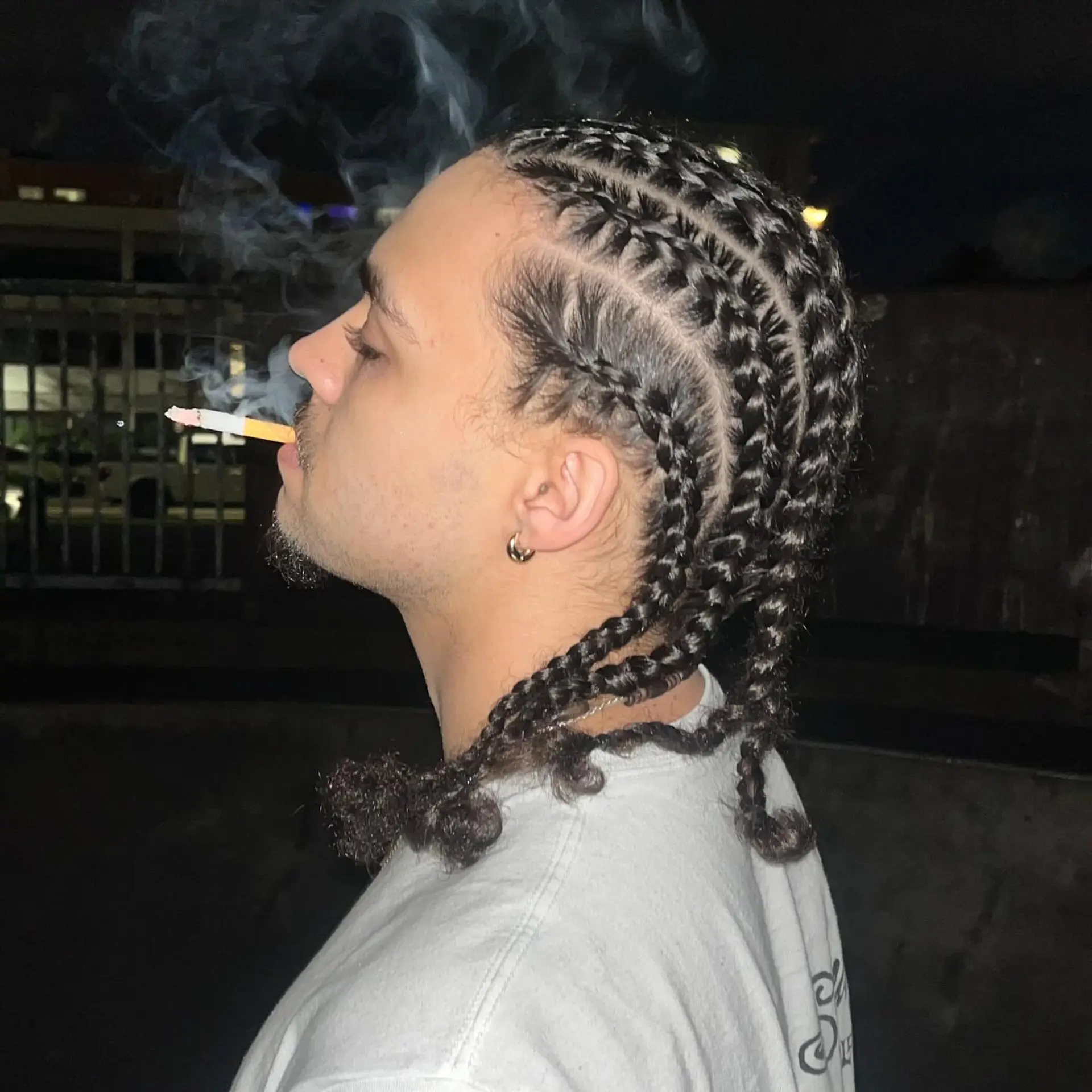 Neat straight-back stitch cornrow braids with defined clean parts and textured curly ends. 1