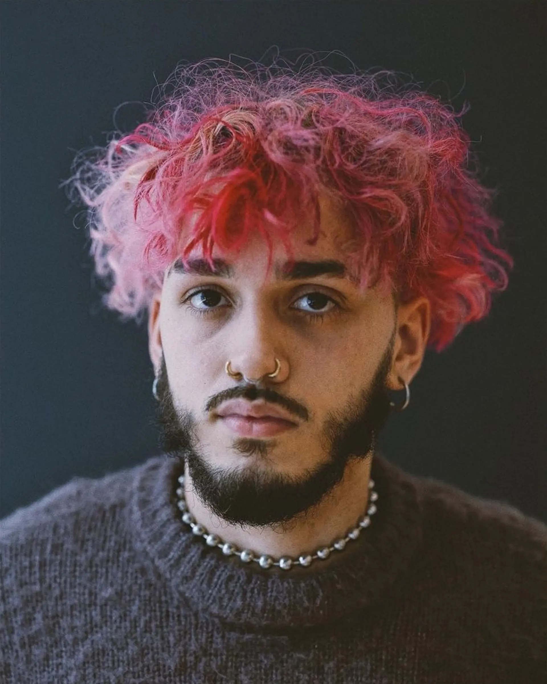 An edgy and bold hairstyle with striking red & blonde curly hair on top, undercut, and fade. The look is complemented by a well-groomed beard.

📸 at KINHOUSE ⁣
By @williamyan ⁣
⁣Hair styled by: @sdr______ 2