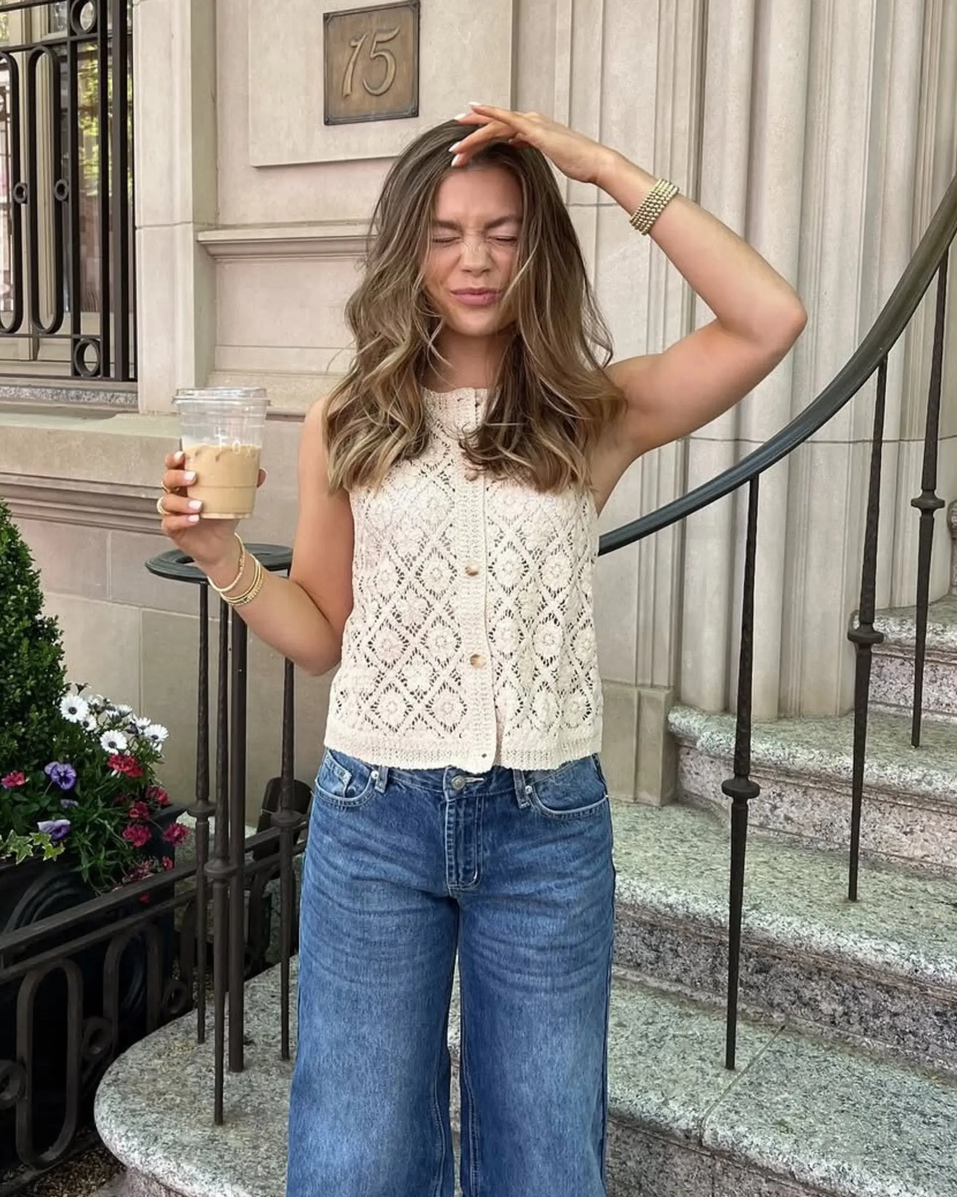 A medium-length wavy hairstyle with a relaxed, beachy feel. The hair is layered for added movement and texture. 1