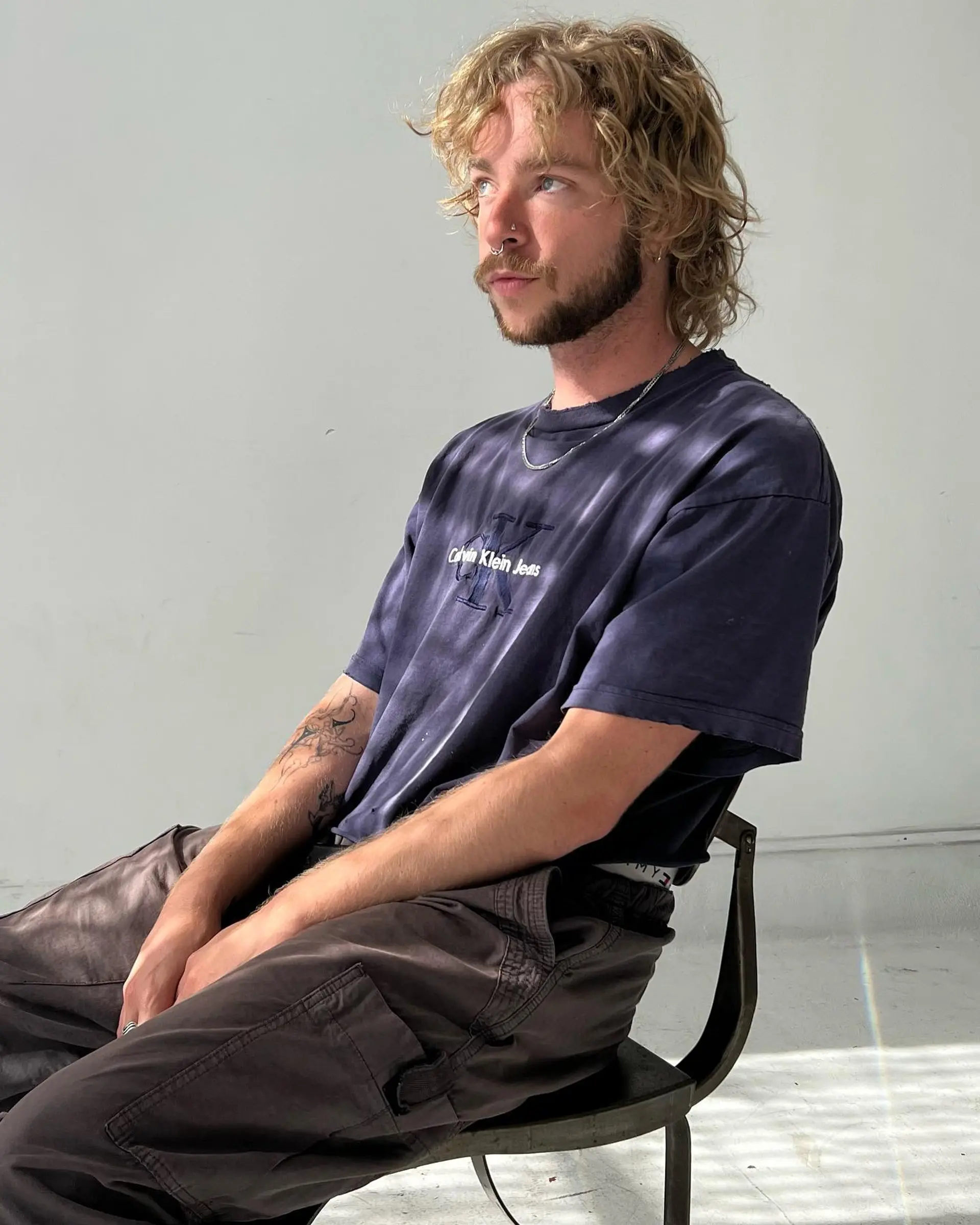 A medium-length textured shag mullet featuring natural waves and soft layered fringe. 1