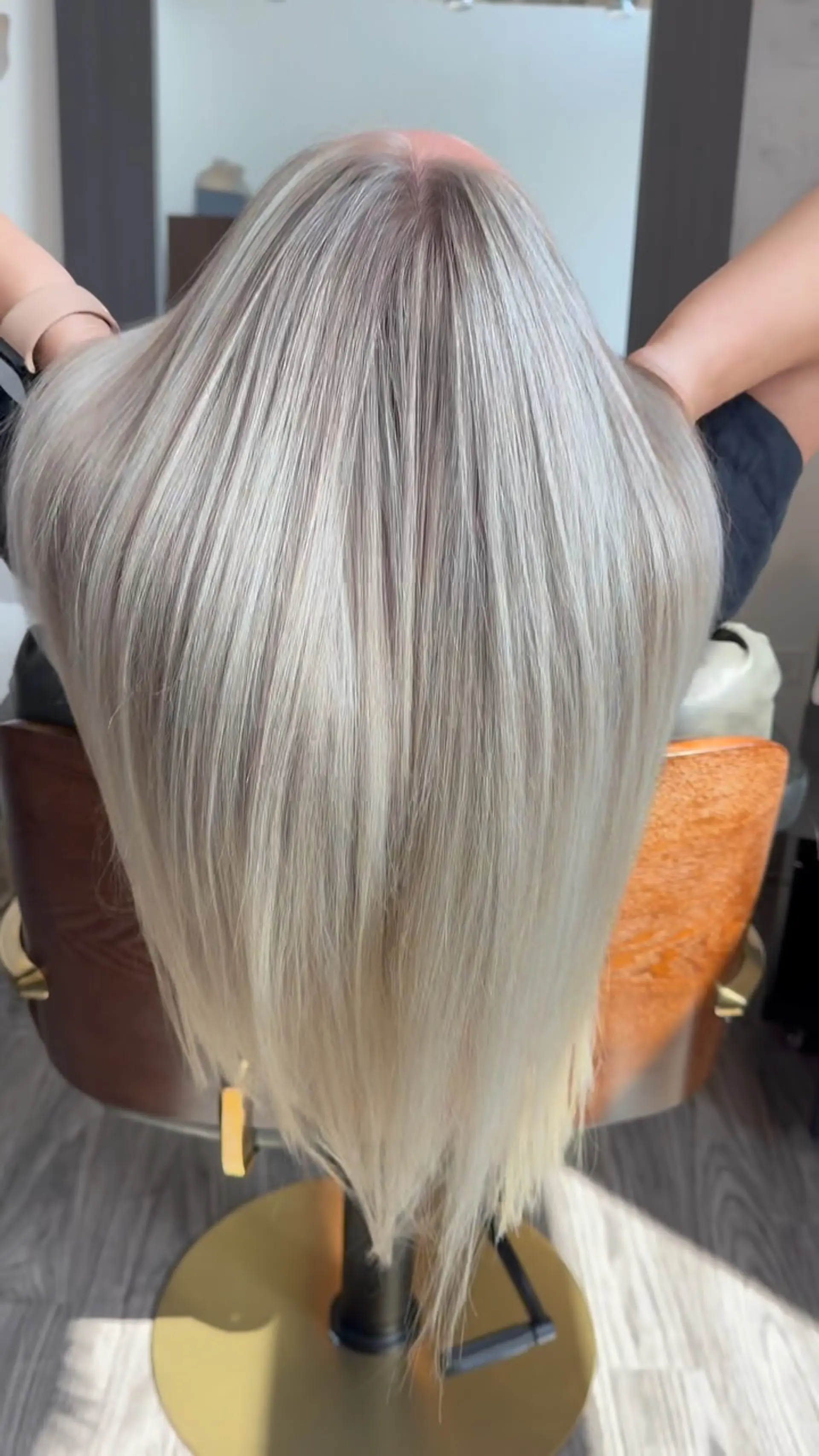 Long, sleek straight platinum blonde hair featuring finely blended highlights and a soft root blend. 1