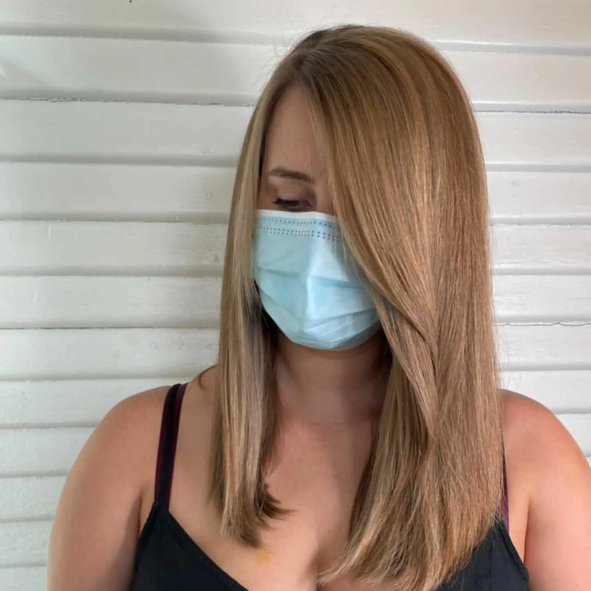Medium-length straight hair featuring fine, warm honey blonde highlights and long side-swept bangs. 1