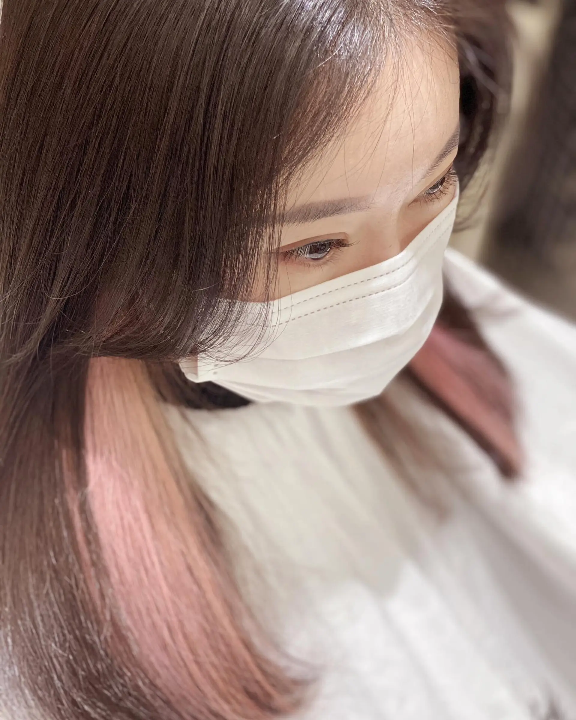 Long, straight hair with subtle hidden pink highlights. 2