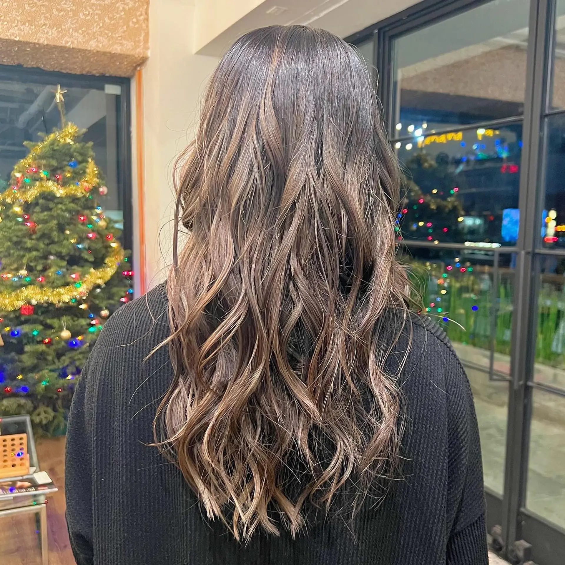Long, layered waves with a balayage color melt. 1
