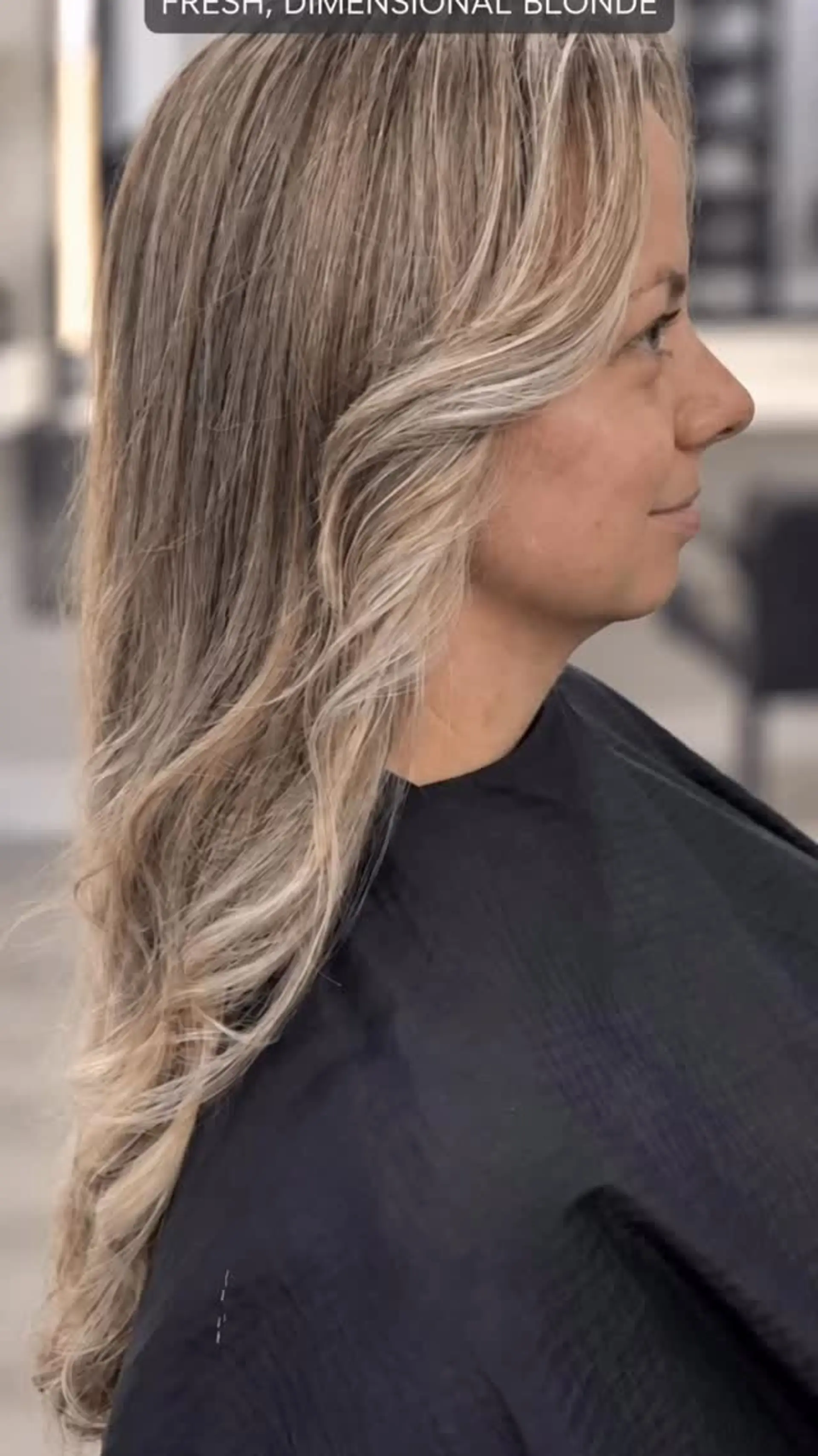 Long hair featuring a fresh, blended dimensional blonde color with soft face-framing waves. 1