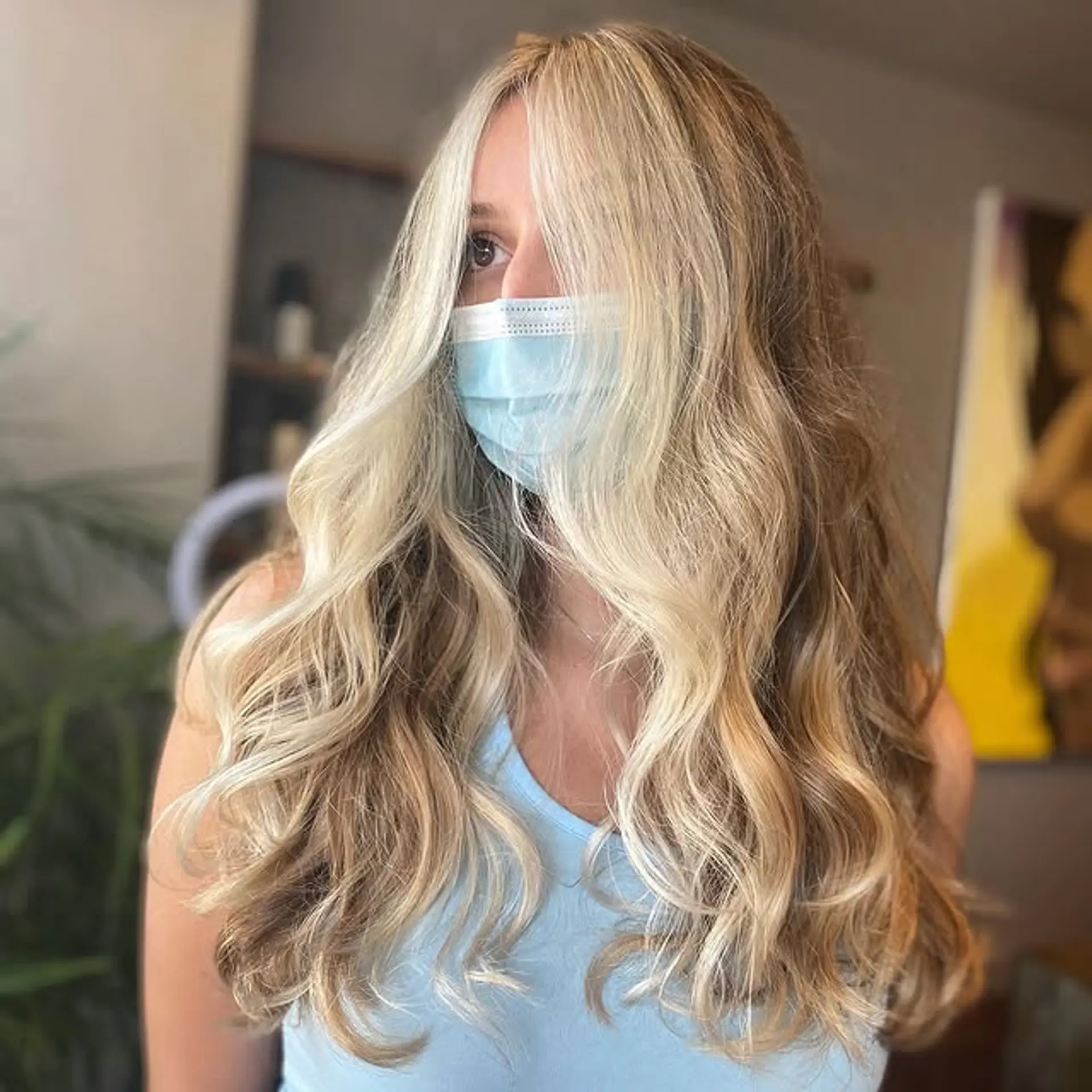 Long, wavy hairstyle with a blonde balayage and face-framing layers for a beachy, sun-kissed look. 1