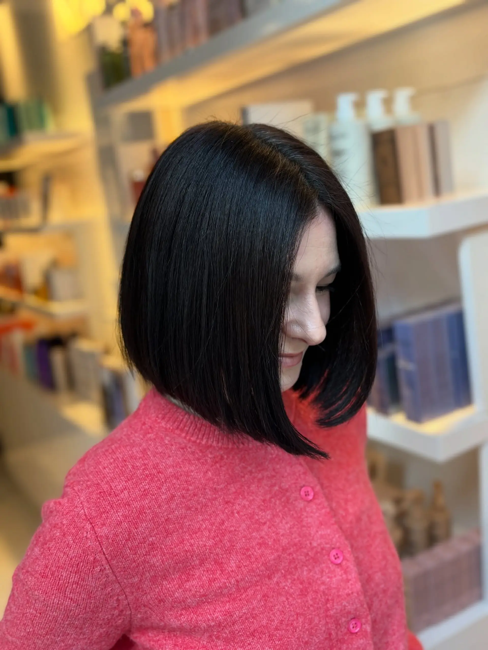 A sleek, sharp angled bob haircut with subtle inward curving ends framing the face. 1