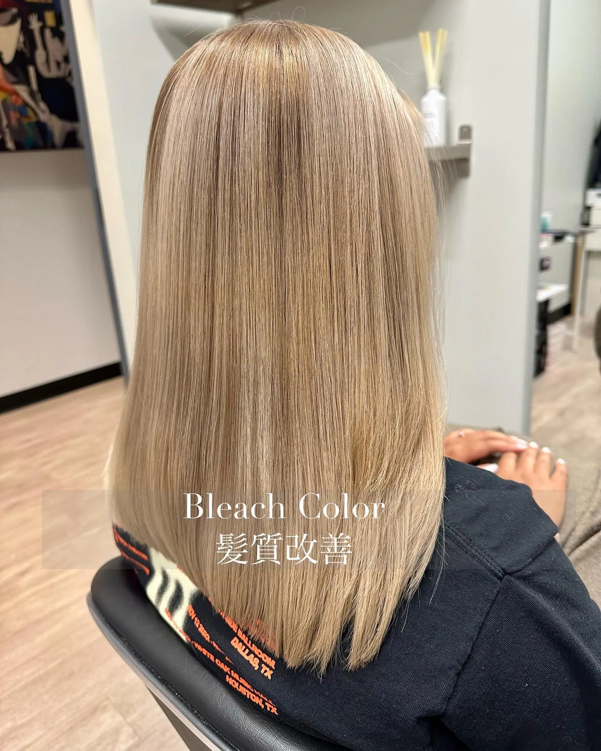 Straight, smooth mid-length hair in an even, bright ash-blonde shade with a sleek, polished finish. 1