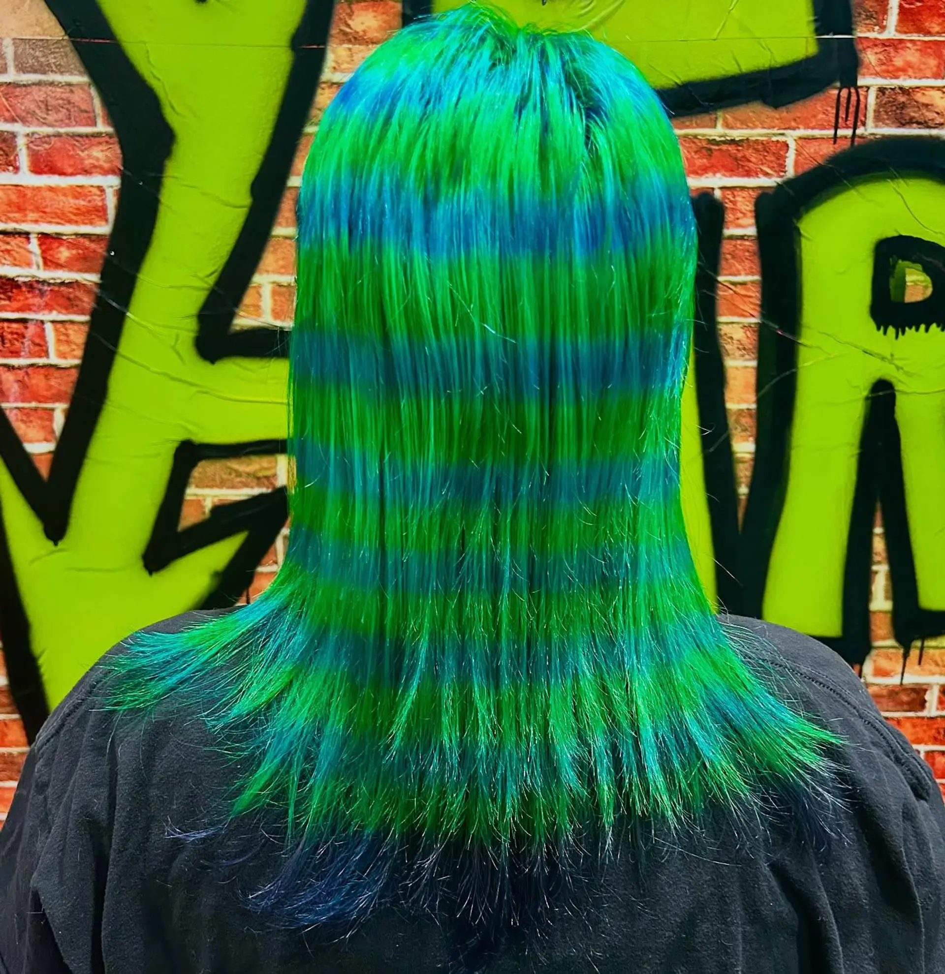 Medium-length straight hair patterned with alternating horizontal bands of neon green and vibrant blue. 1