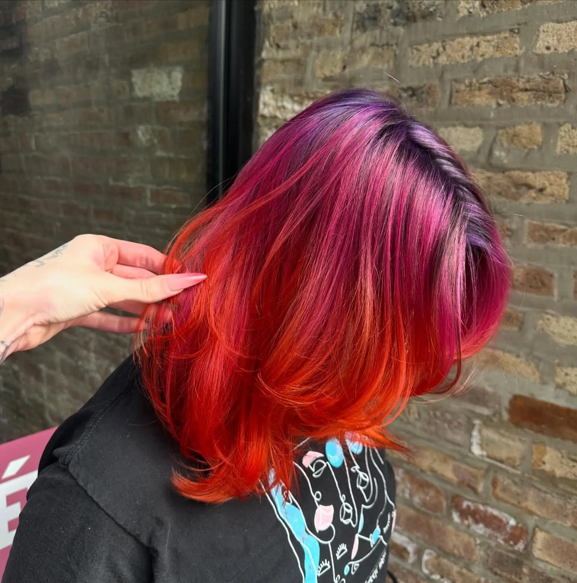 A medium-length shag with a vibrant sunset ombre effect. 2