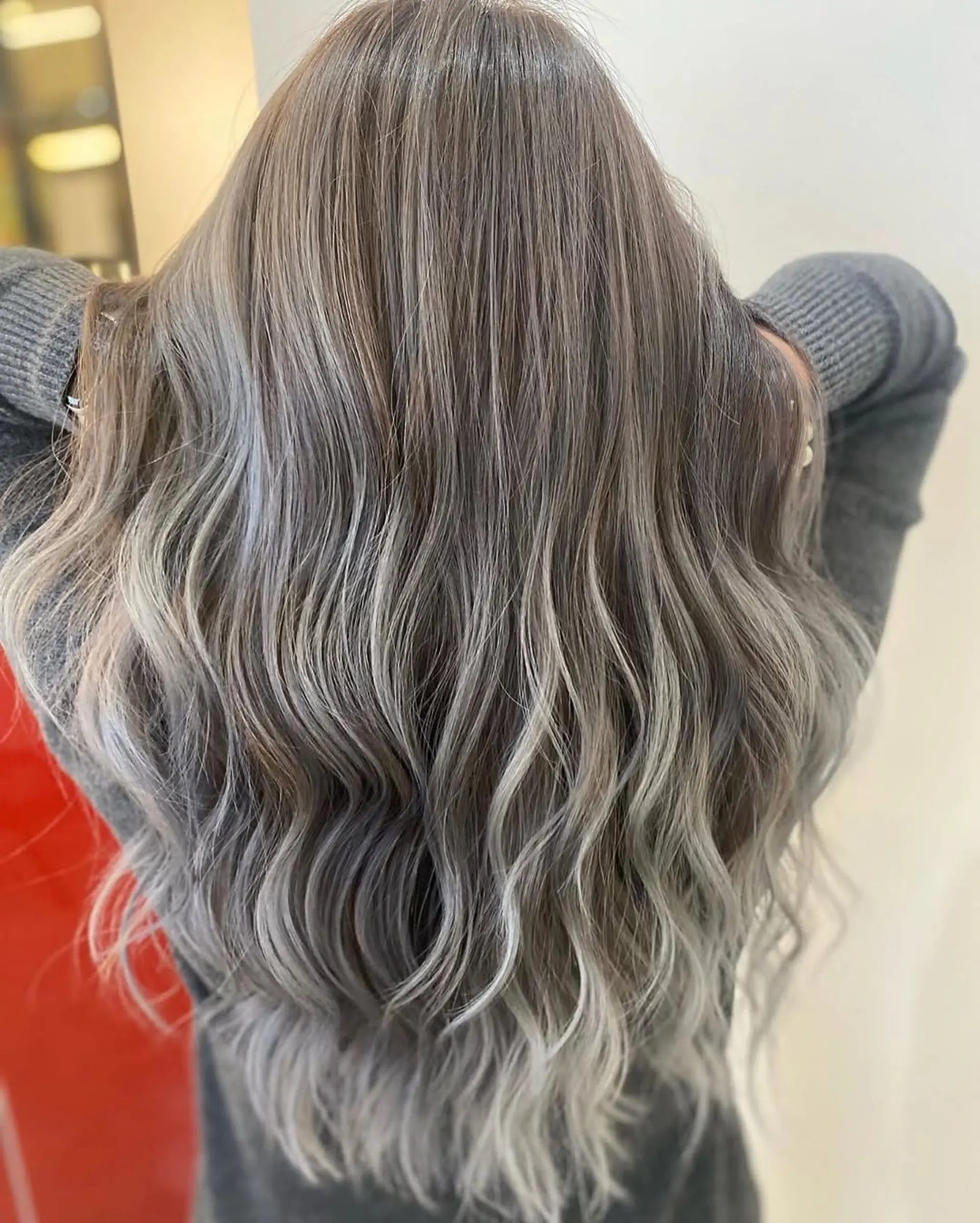A seamless ash blonde balayage with cool-toned highlights. 1