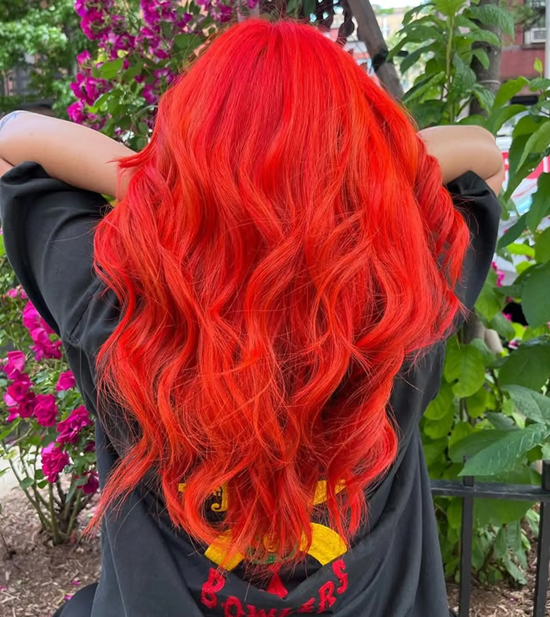 Long, vibrant red-orange wavy hairstyle. 1