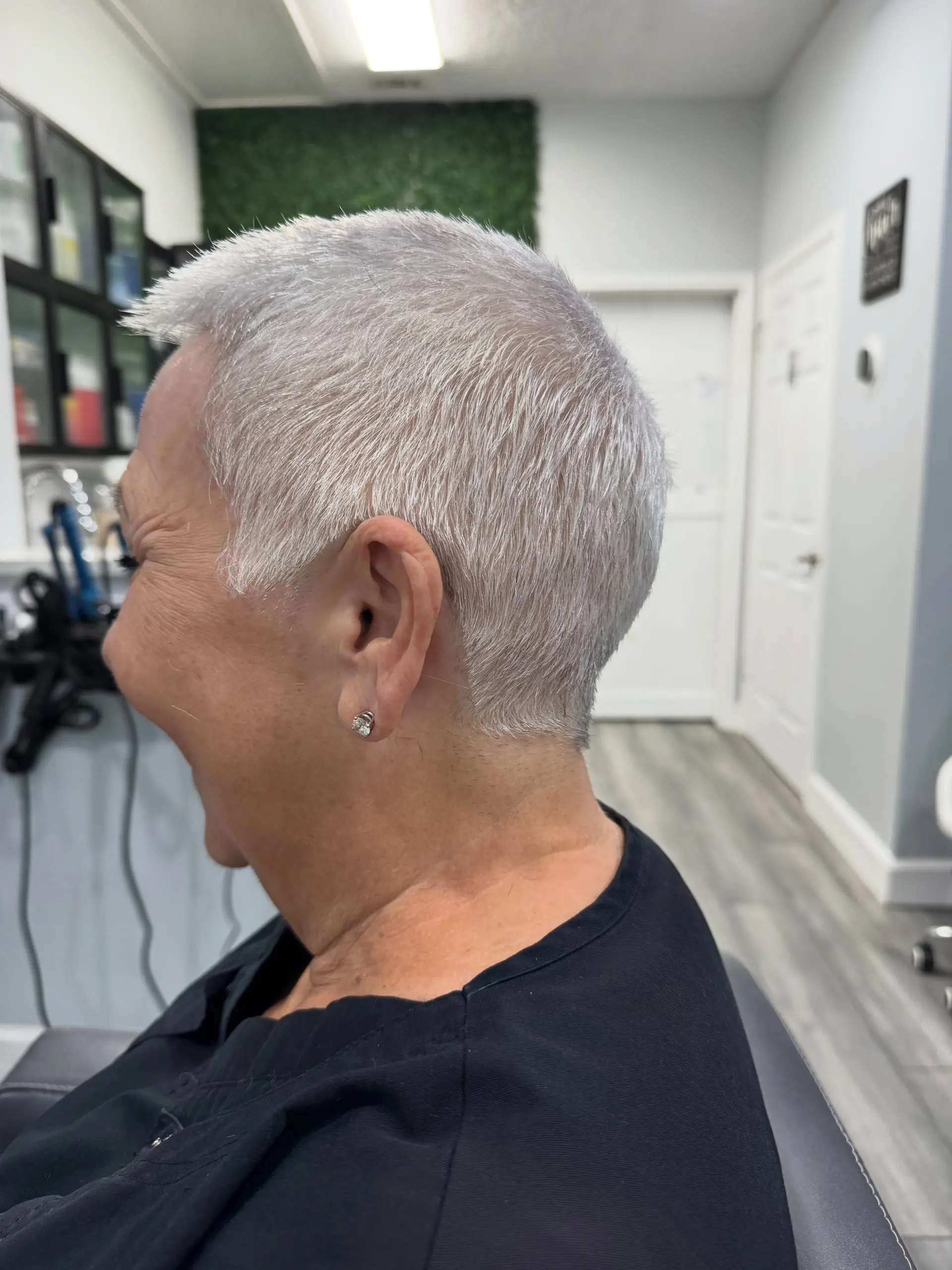 A bright silver-white cropped pixie cut with a clean, tapered finish. 1
