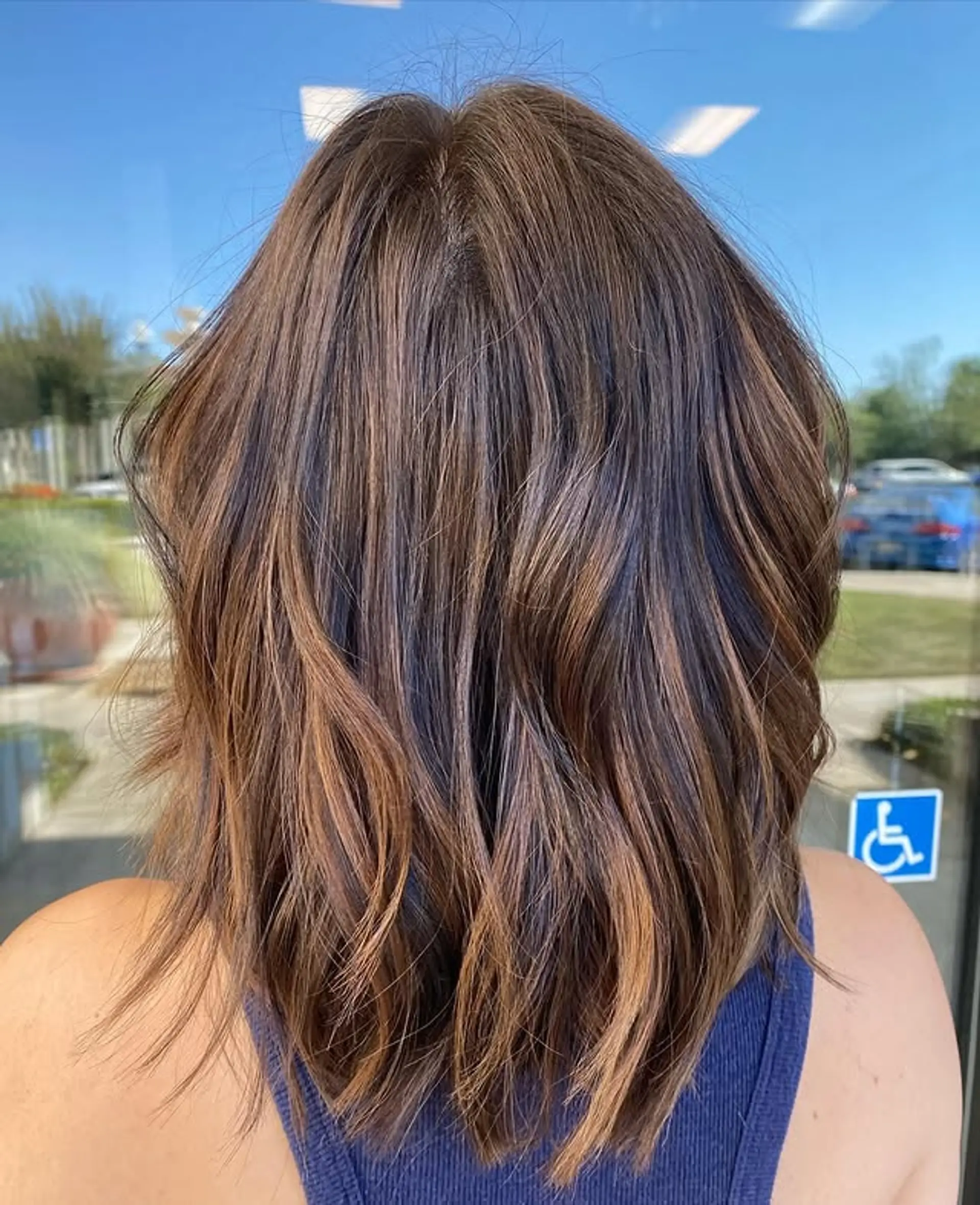 A trendy layered lob with a beautiful bronzed balayage. 1