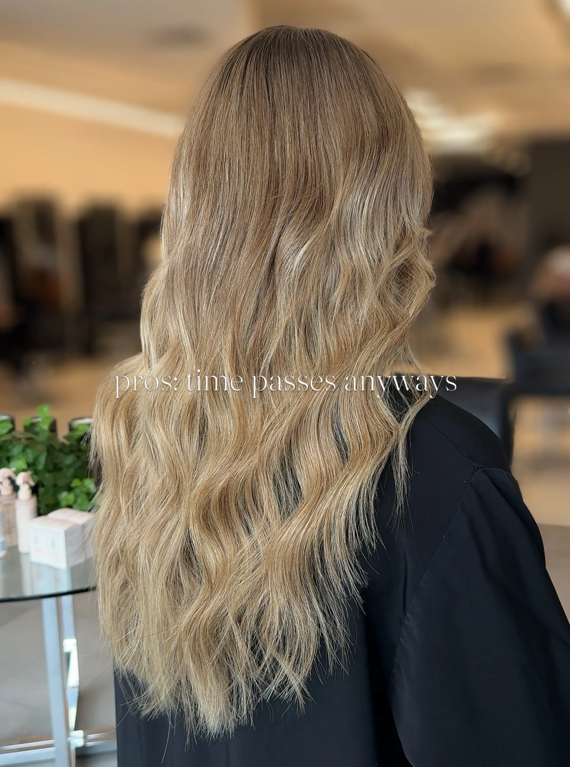 Long honey-blonde hair styled in effortless, cascading loose waves with dimensional balayage highlights. 1