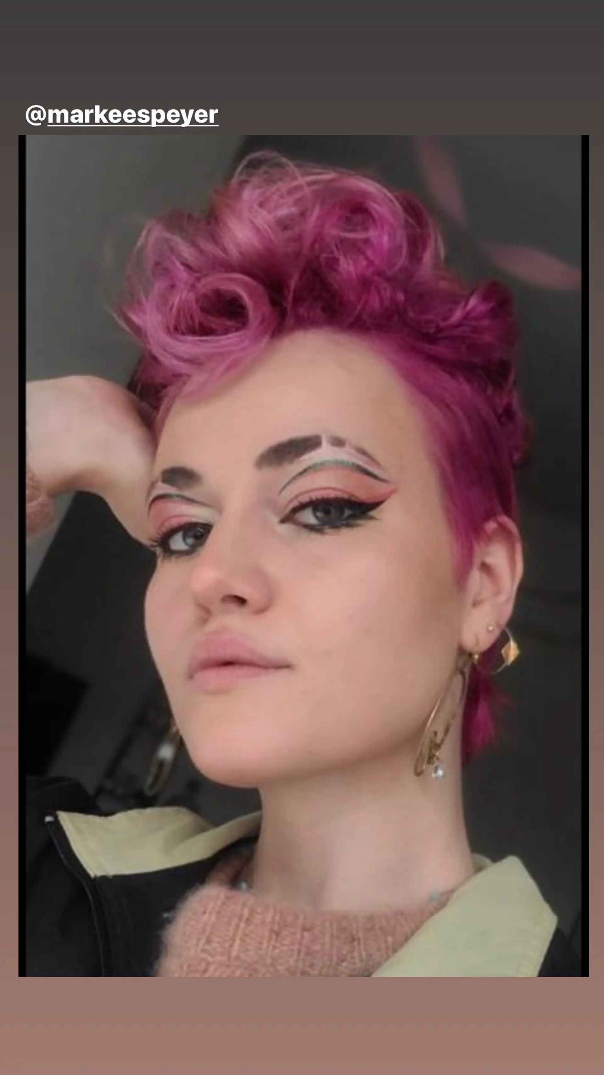 A short, textured pixie cut styled for volume and definition. 1