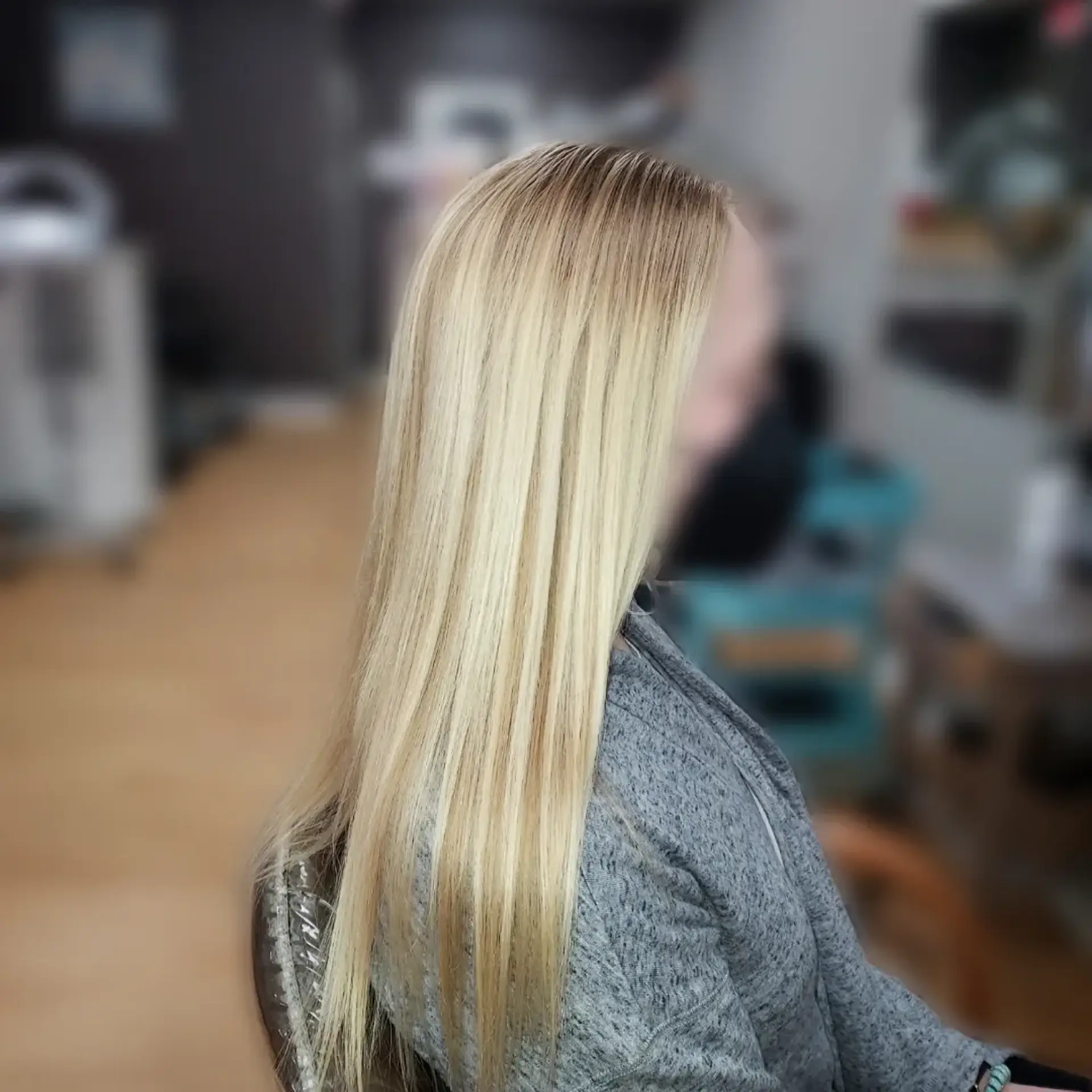 Silky, pin-straight blonde hair falling smoothly past mid-back with high shine. 1