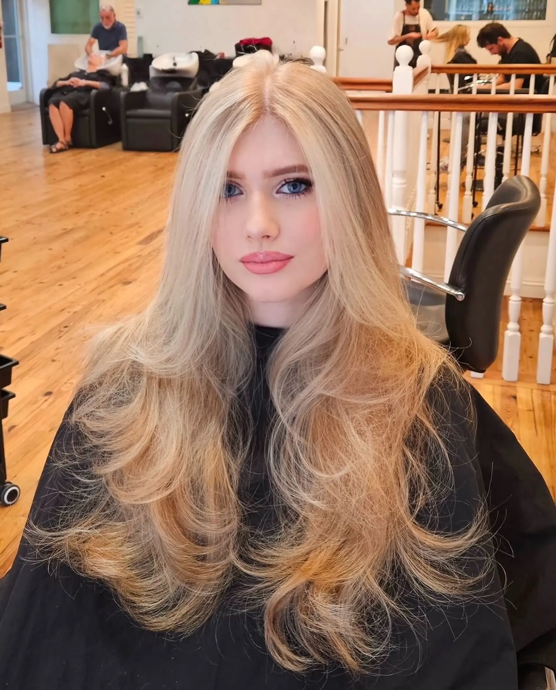 Long, straight hair with layers and a honey blonde balayage. 2