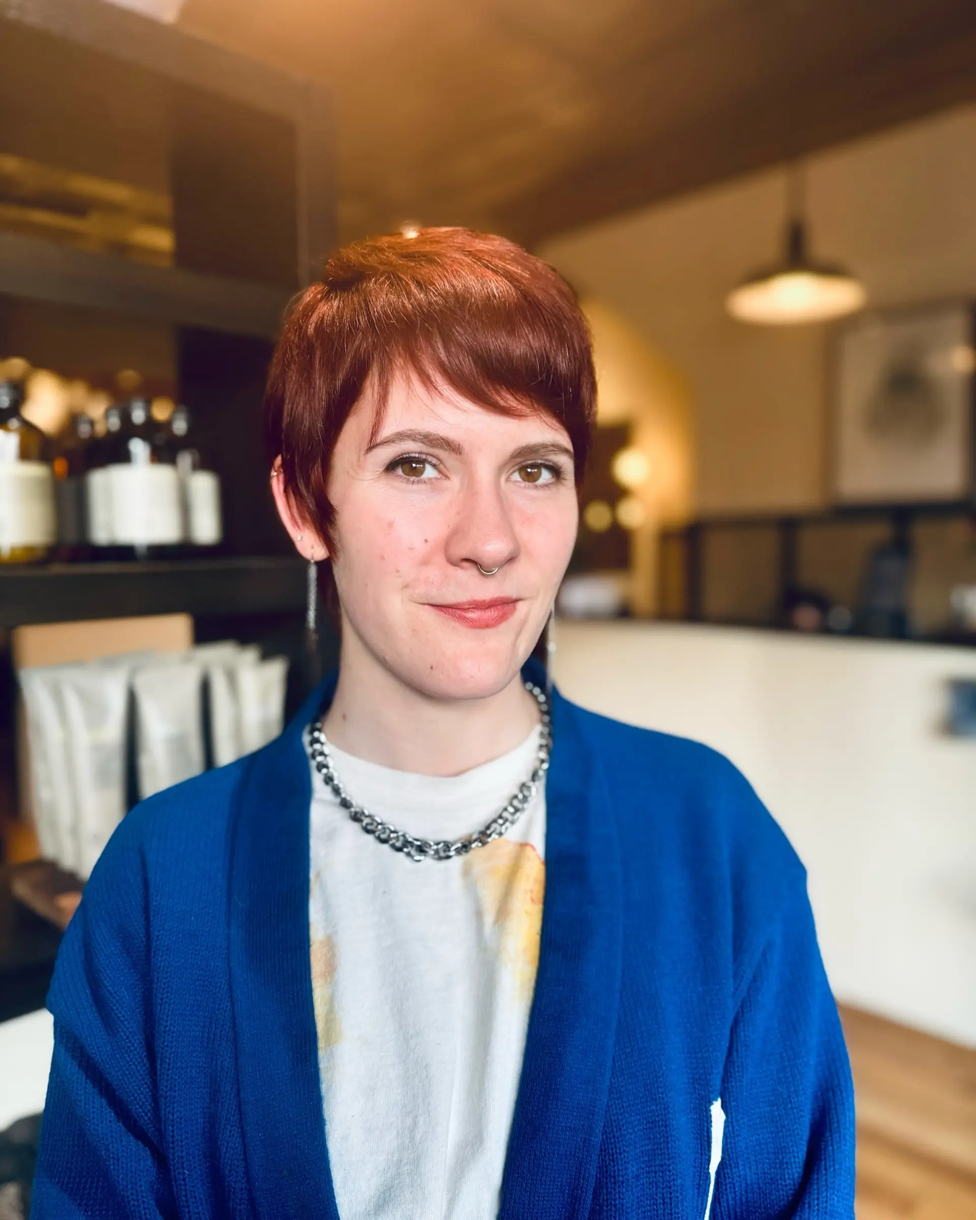 A textured pixie cut, styled for volume and a modern, edgy look. 1